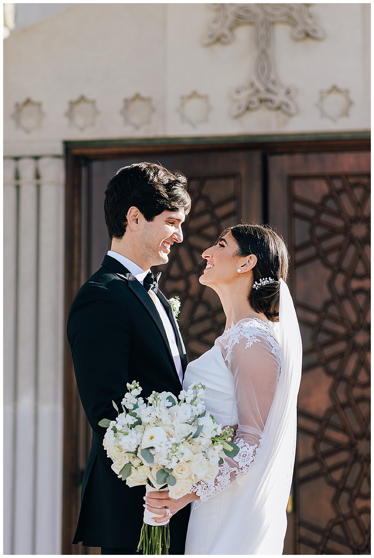 Couple smile at each other for Kayla Bouren Photography