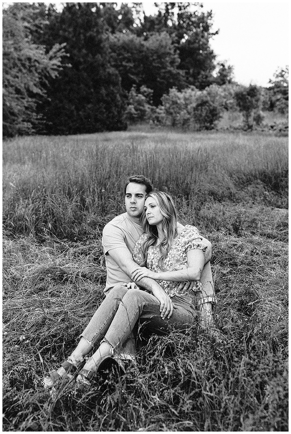 Fiances sit together during Island Lake State Park Engagement Session