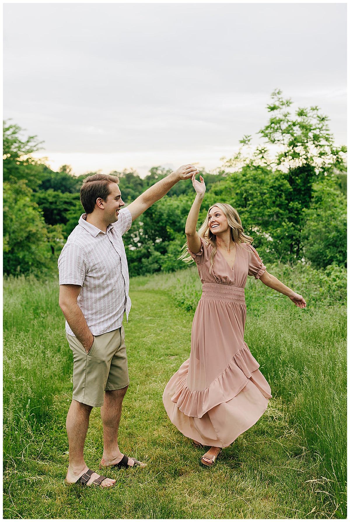 Adults dance in grass for Detroit wedding photographer