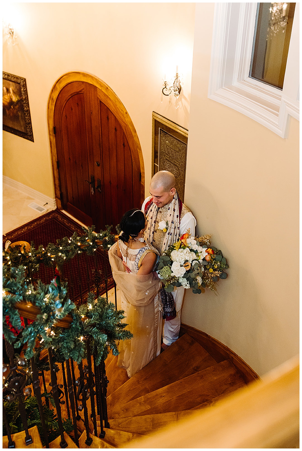 Bride and groom on staircase for Kayla Bouren Photography