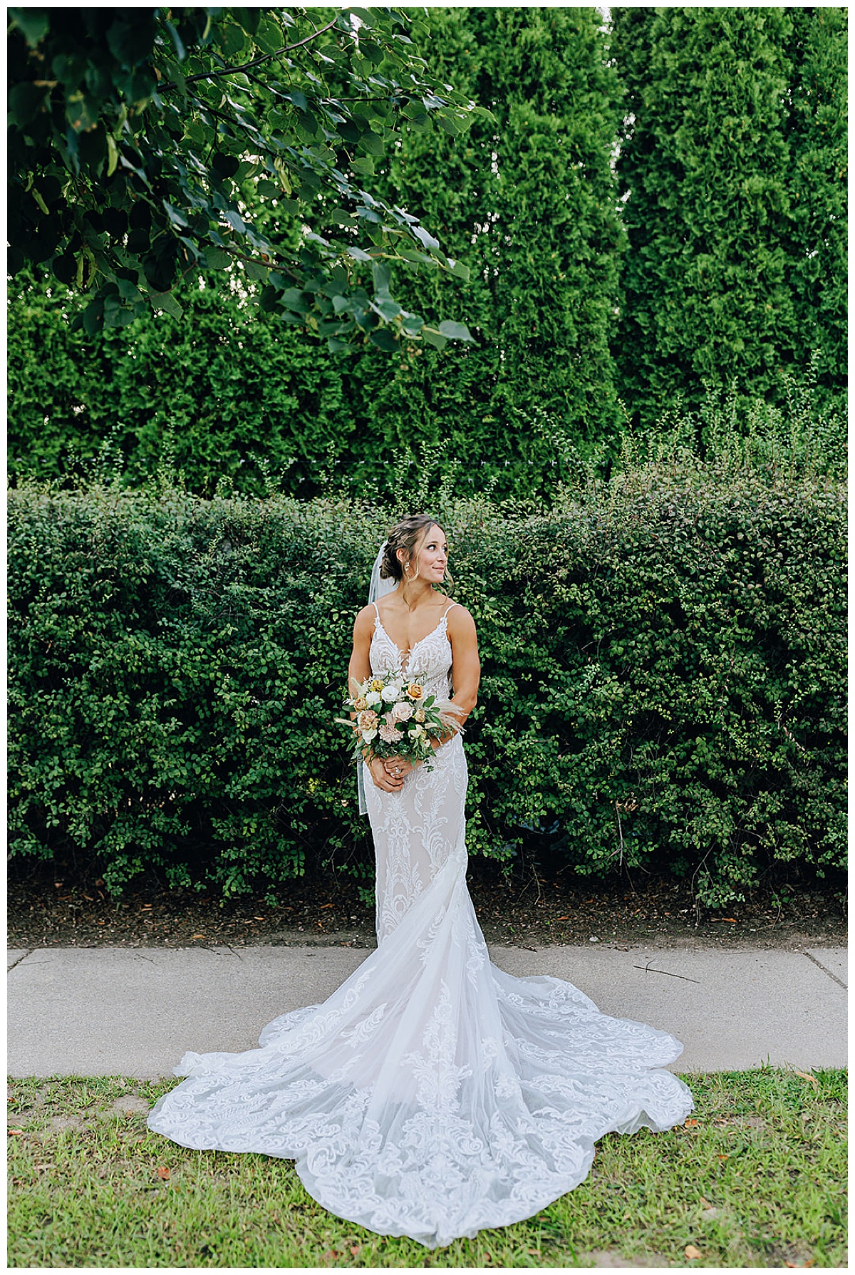 Bride looks over shoulder for Detroit Wedding Photographer