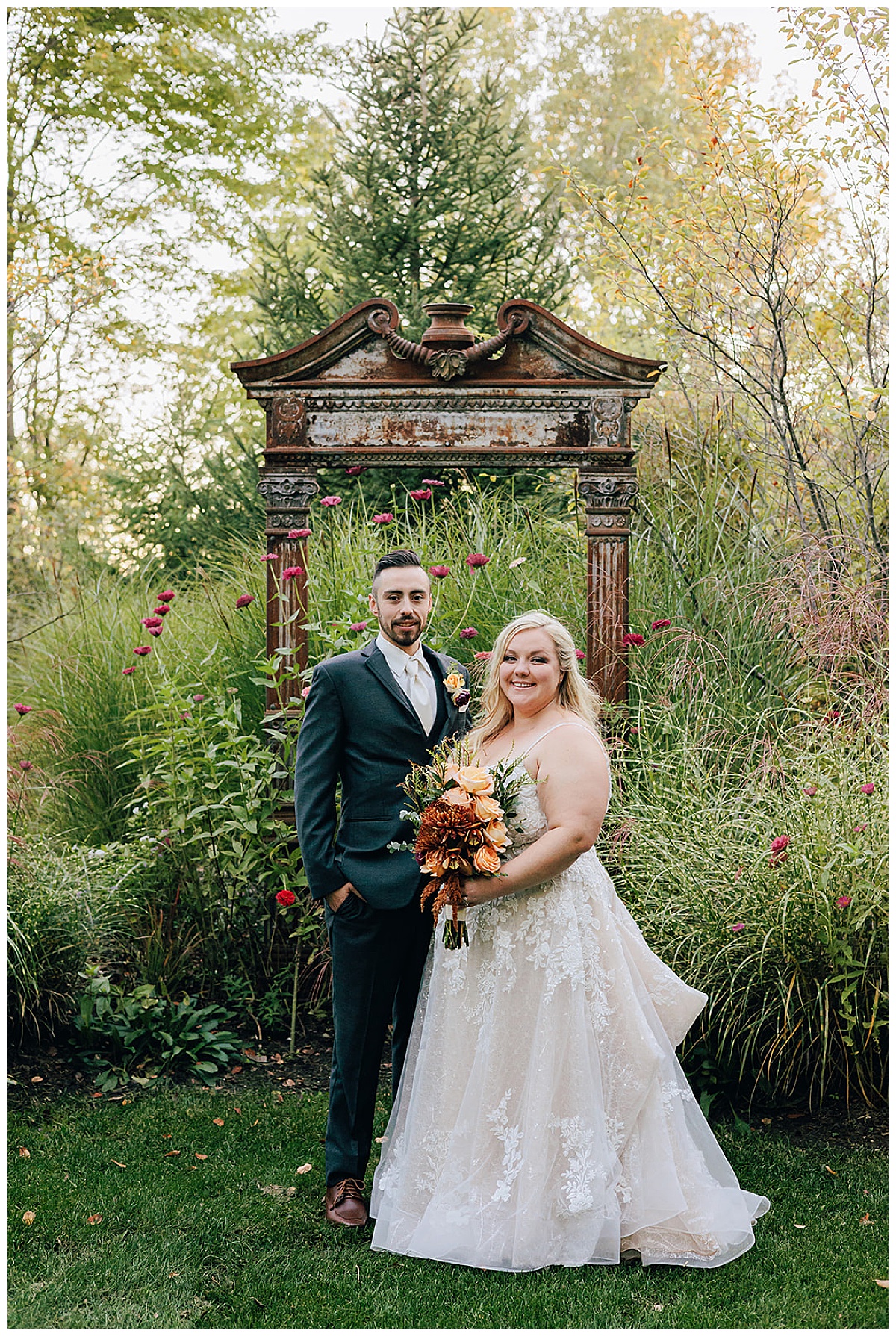 Husband and wife smile big for Holly Township Wedding