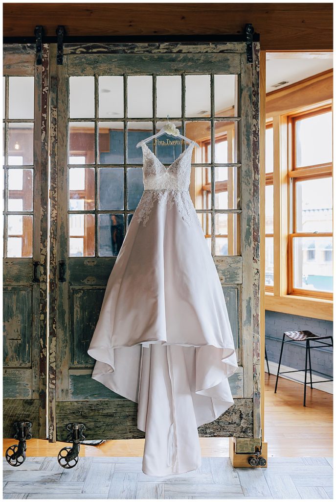 Bridal gown on wood door for Detroit Wedding Photographer