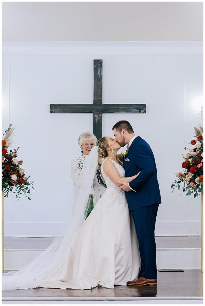 Bride and groom kiss at Holly Vault Chapel 