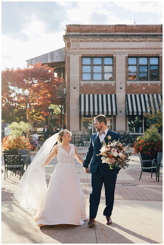 Couple walk and smile together for Detroit Wedding Photographer