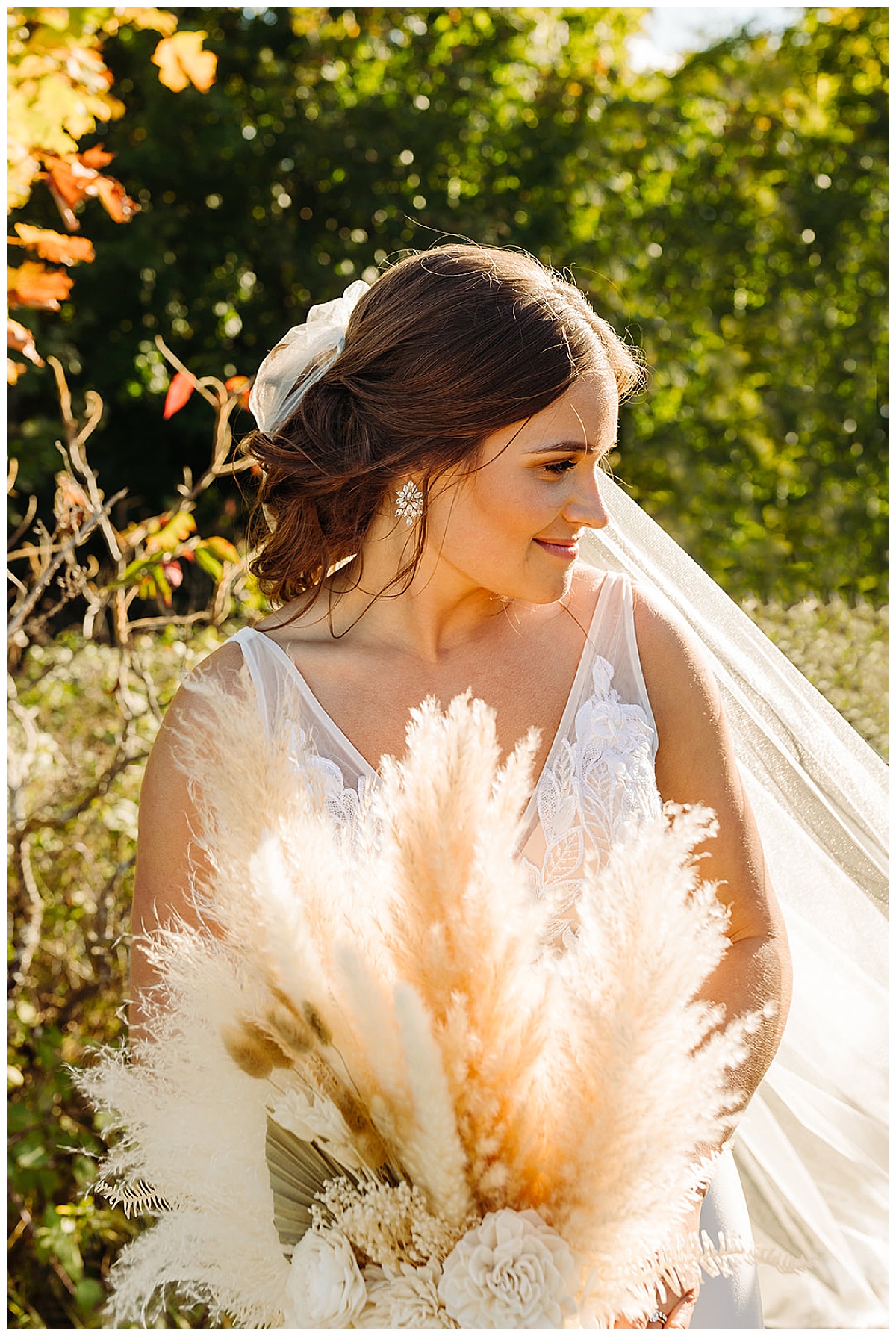 Bride smiles with florals for Black Star Farms 