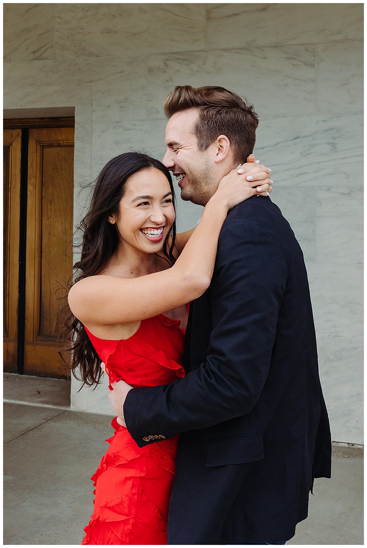 Future husband and wife laugh together for DIA Engagement Session
