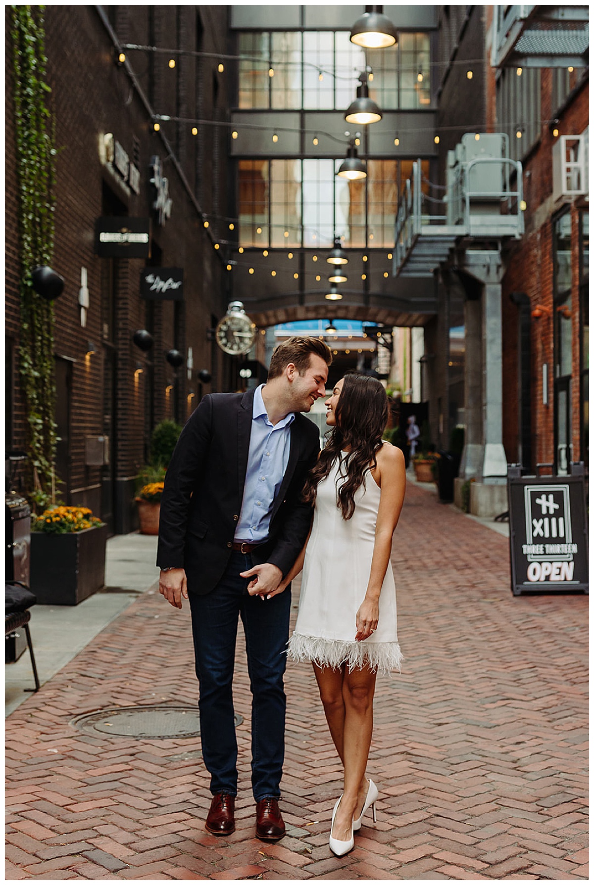 Future husband and wife smile at one another for  DIA Engagement Session