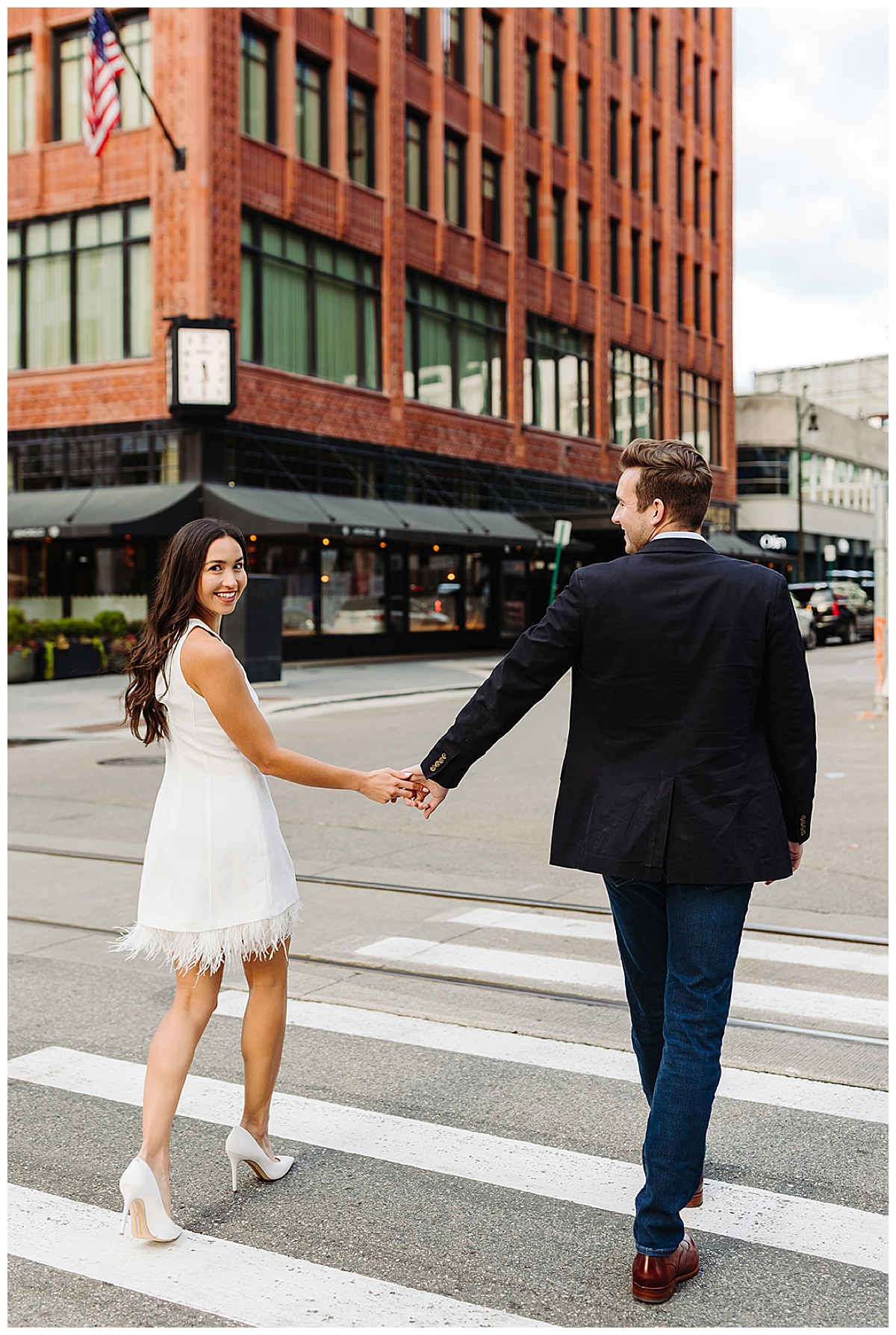 Couple walk down street for Detroit Wedding Photographer