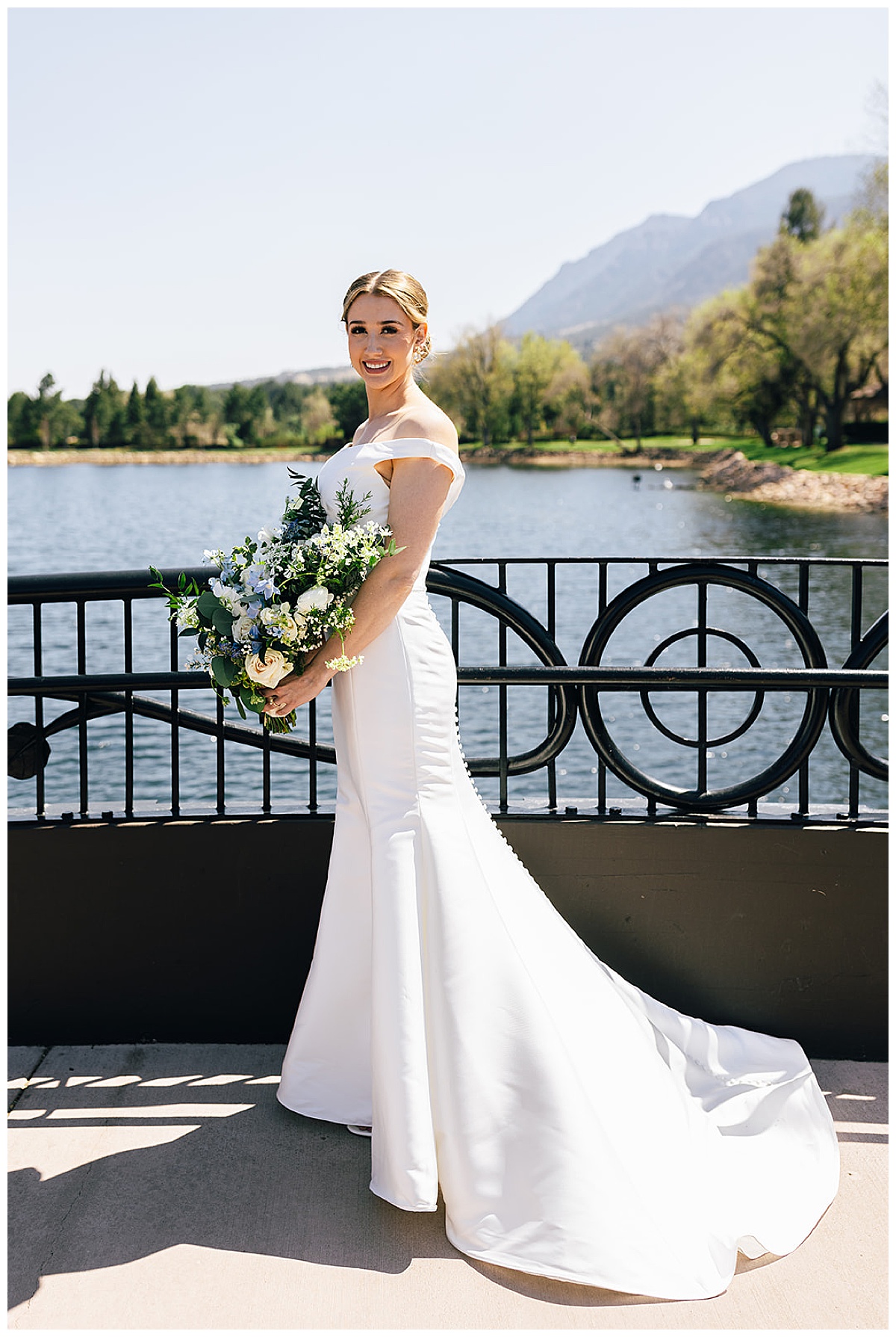 Woman stands outside in bridal gown for luxury Colorado wedding