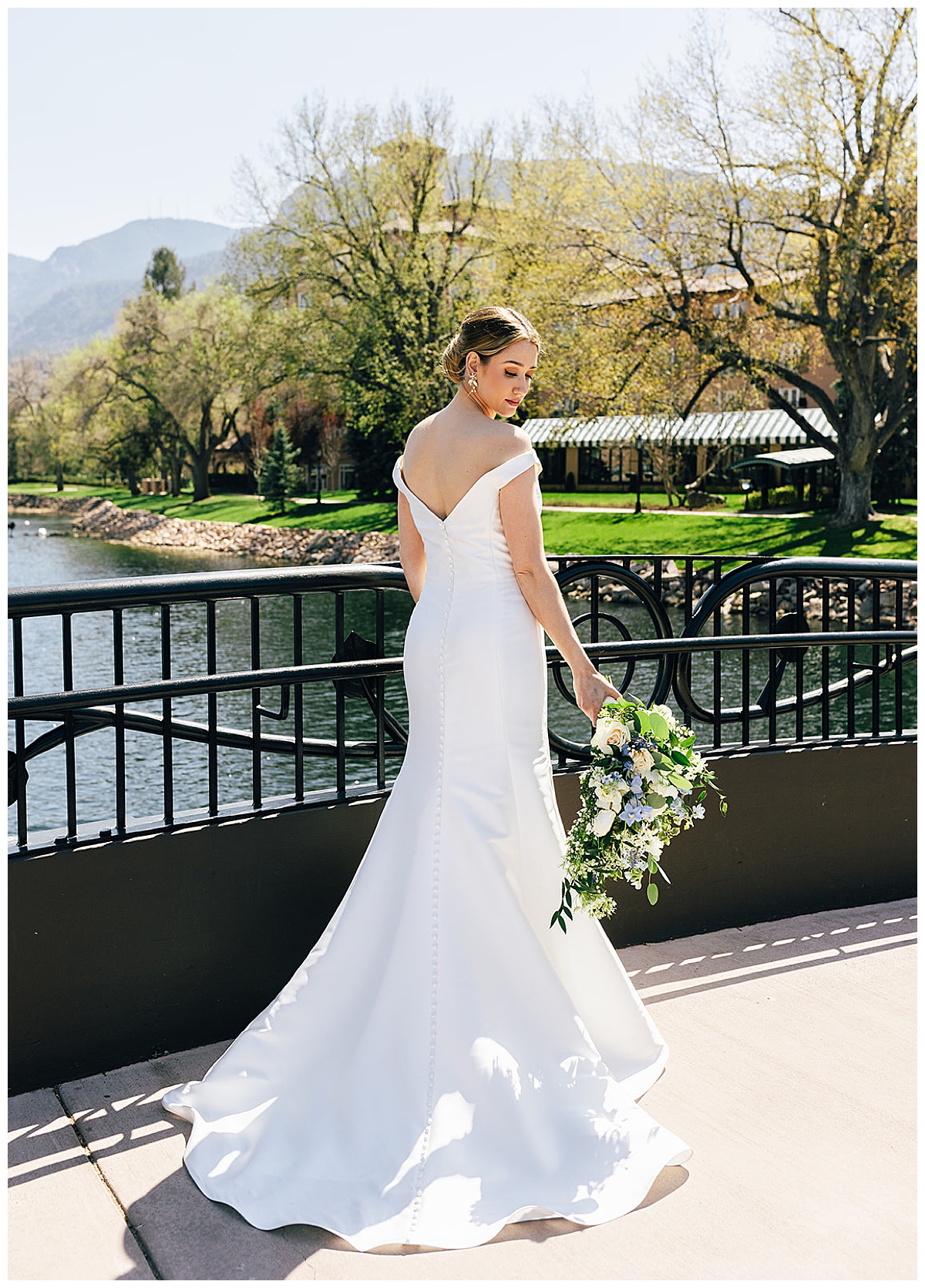 Beuaitiful white gown in front of water for Detroit Wedding Photographer