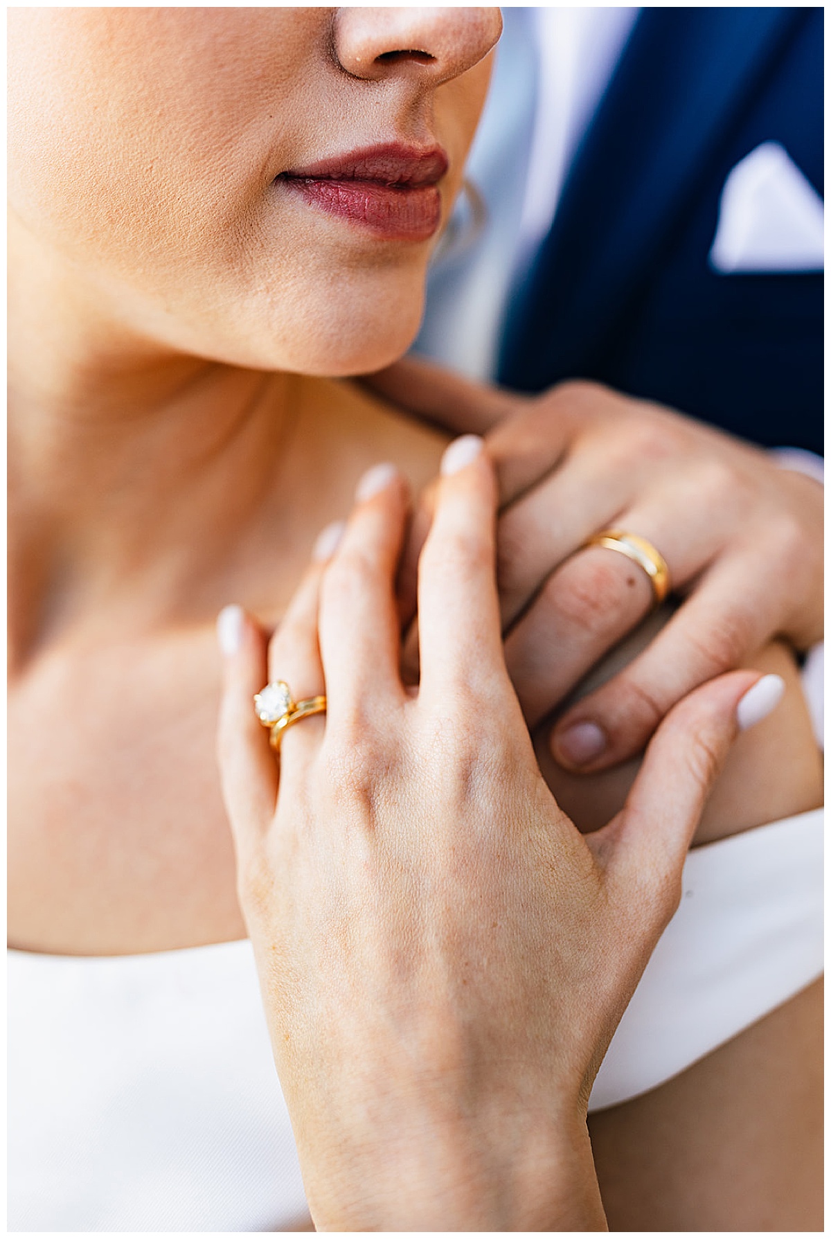 showing off new rings while holding hands by Detroit Wedding Photographer