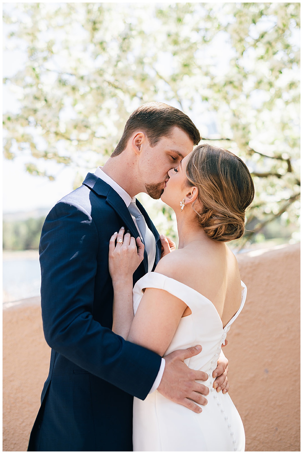 Couple share a kiss for Kayla Bouren Photography