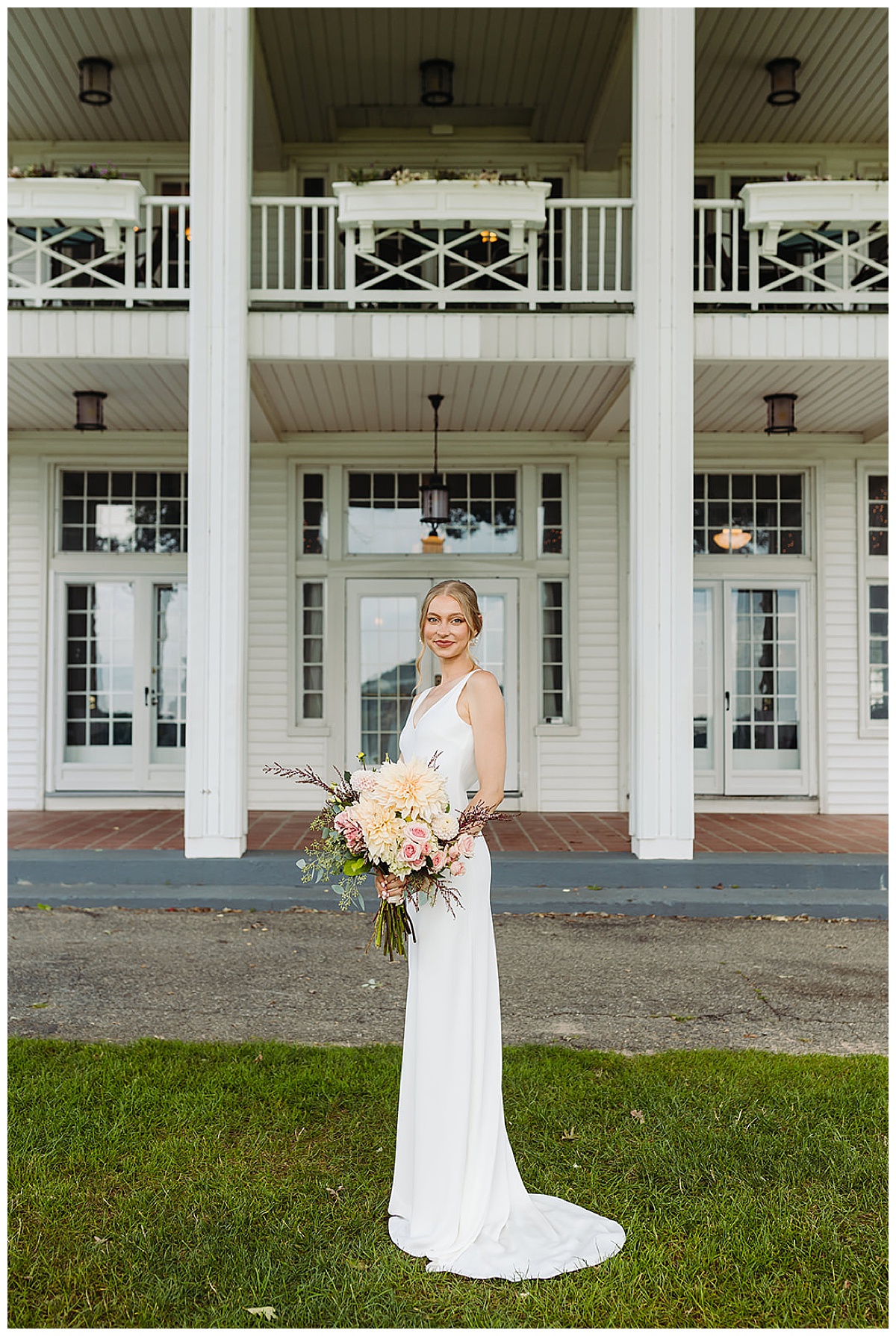 Beautifull bride in front of venue for Kayla Bouren Photography