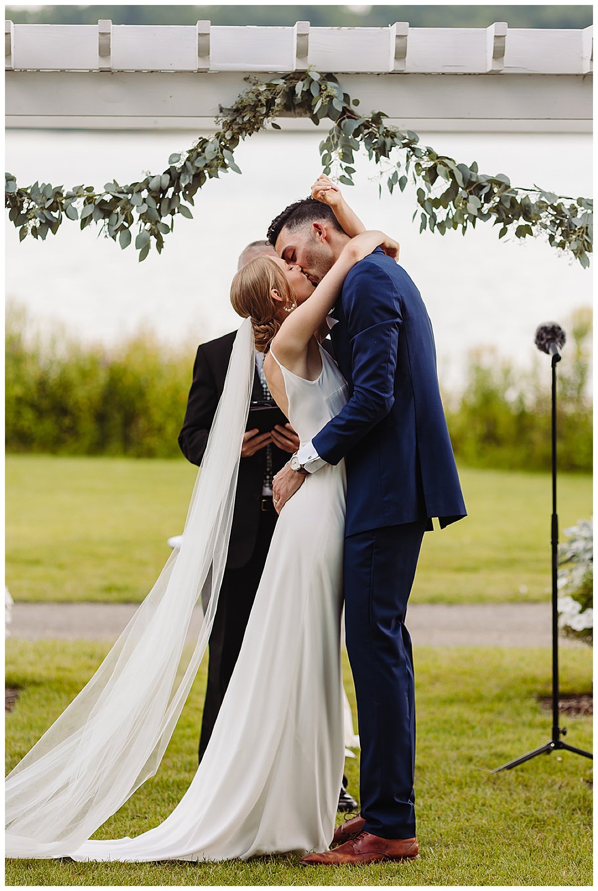 Husband and wife share their first kiss as married couple for Kayla Bouren Photography