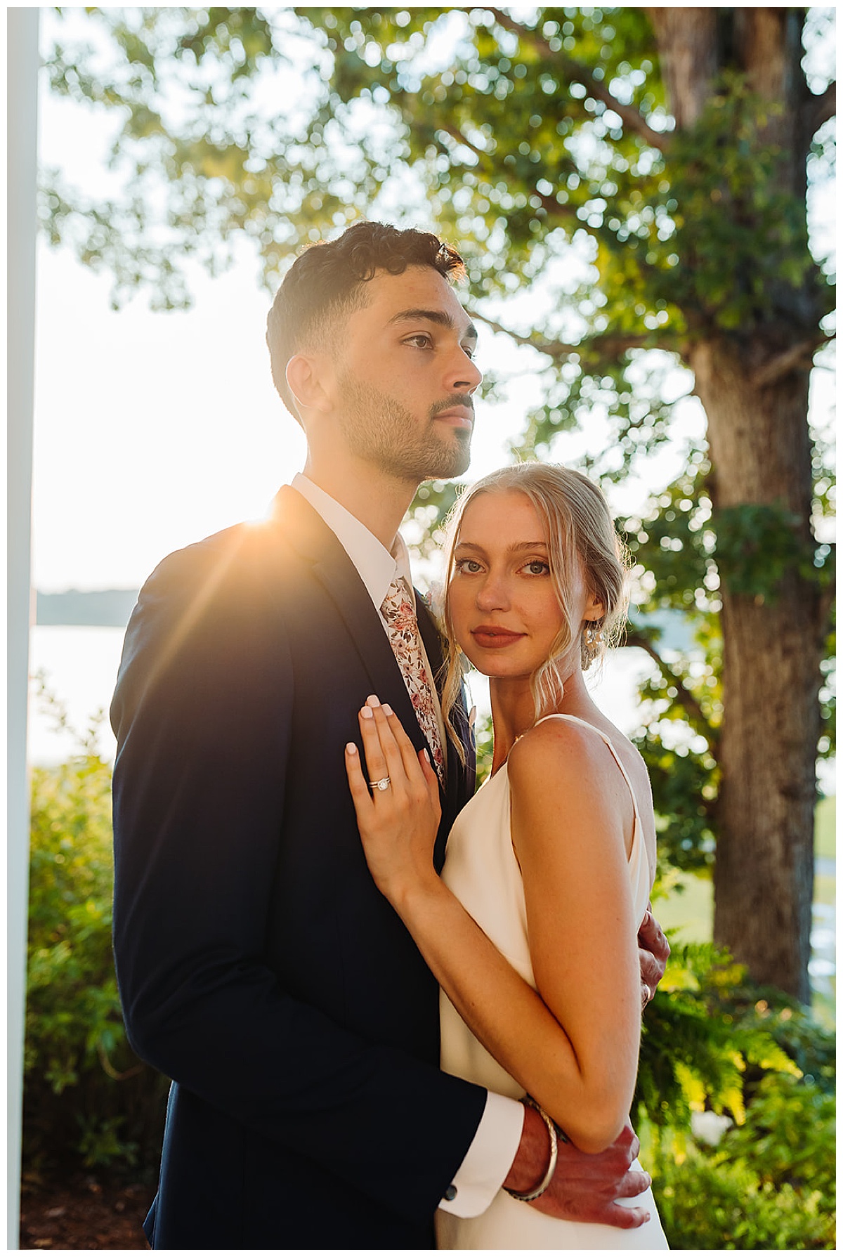 Bride and groom stand close together for Kayla Bouren Photography