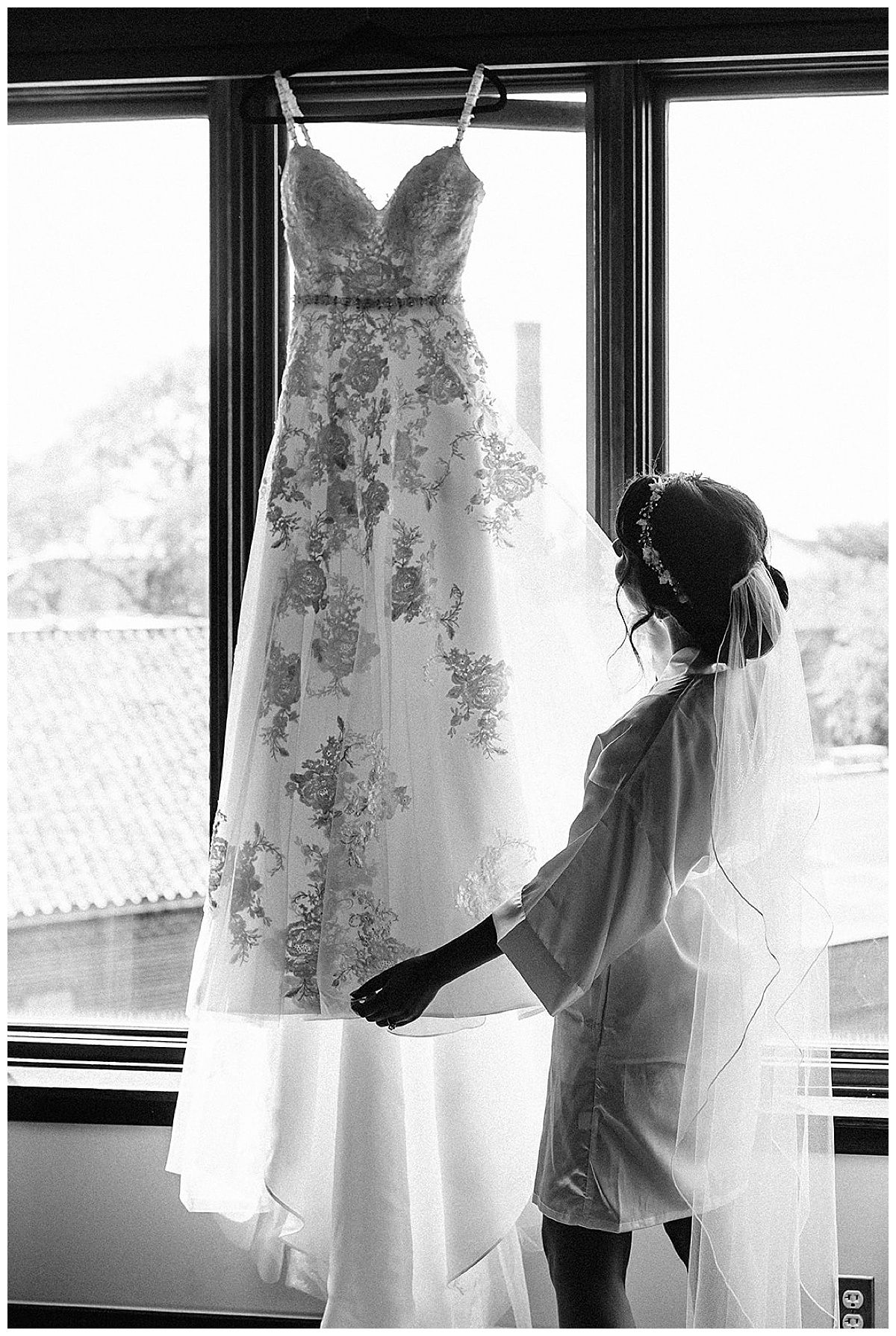Bride gets bridal gown ready by Detroit Wedding Photographer