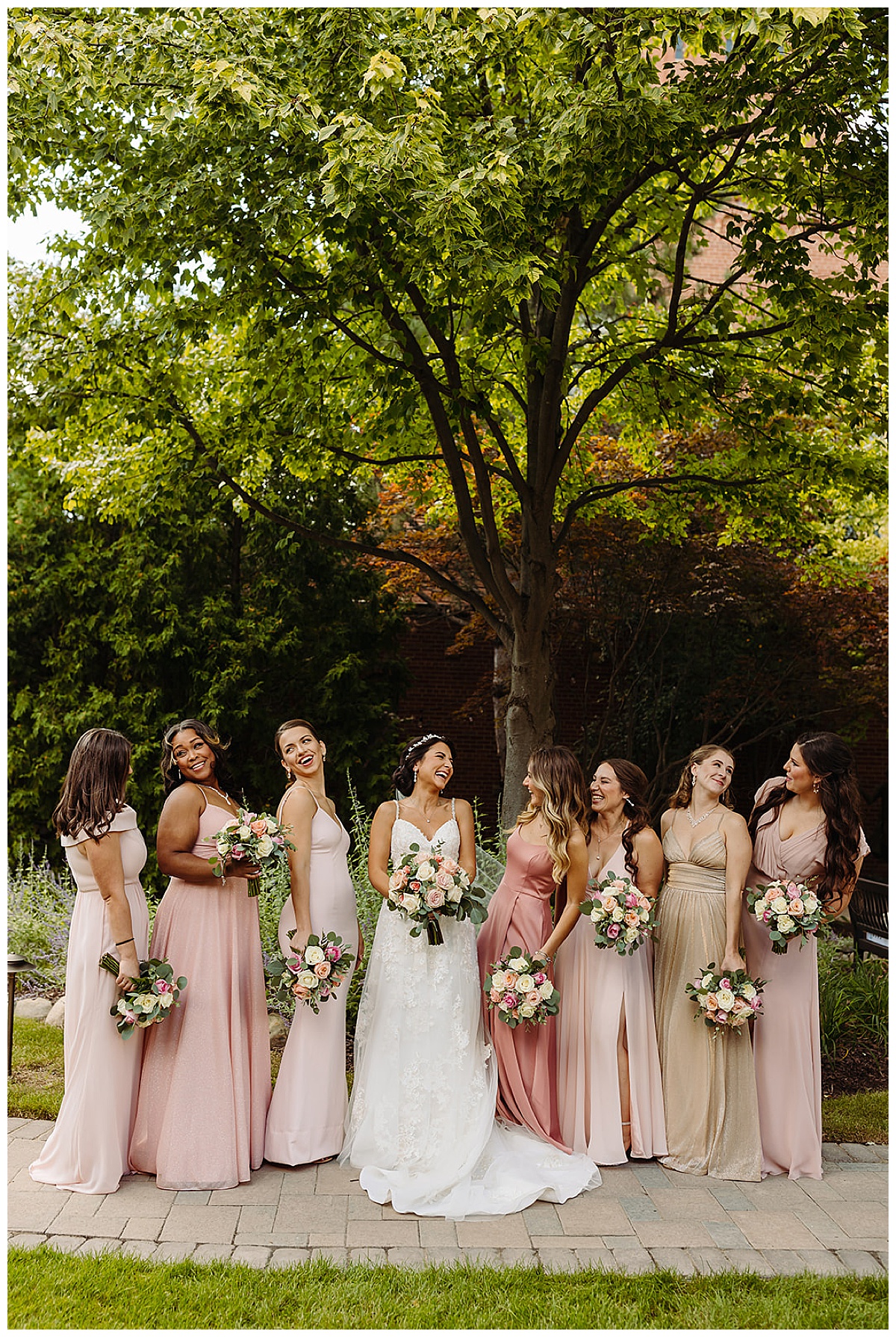 Gorgeous bridesmaids laugh together for Detroit Wedding Photographer