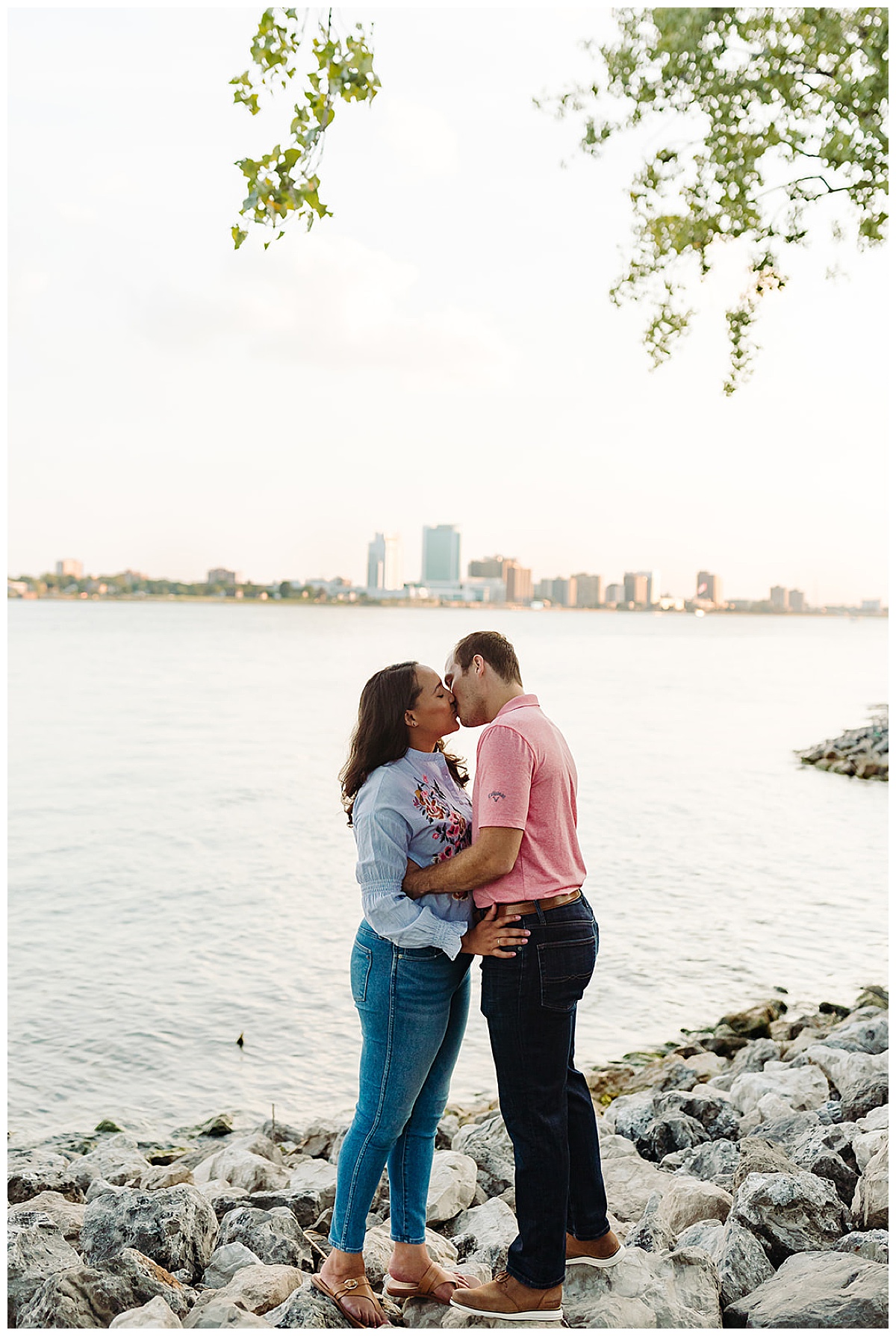 Couple kisses in front of water for Detroit Wedding Photographer