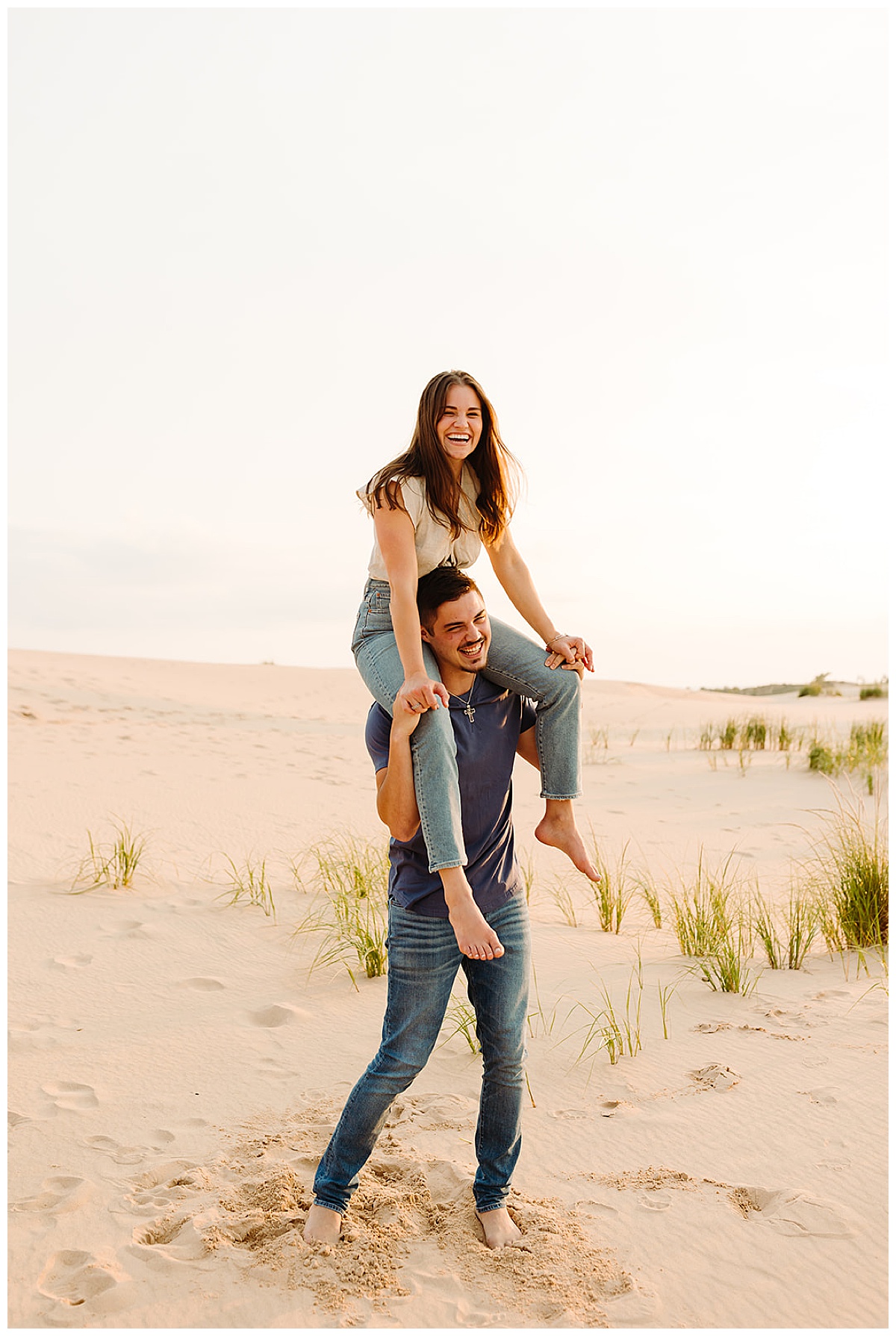 Woman rides on shoulders of guy for Kayla Bouren Photography