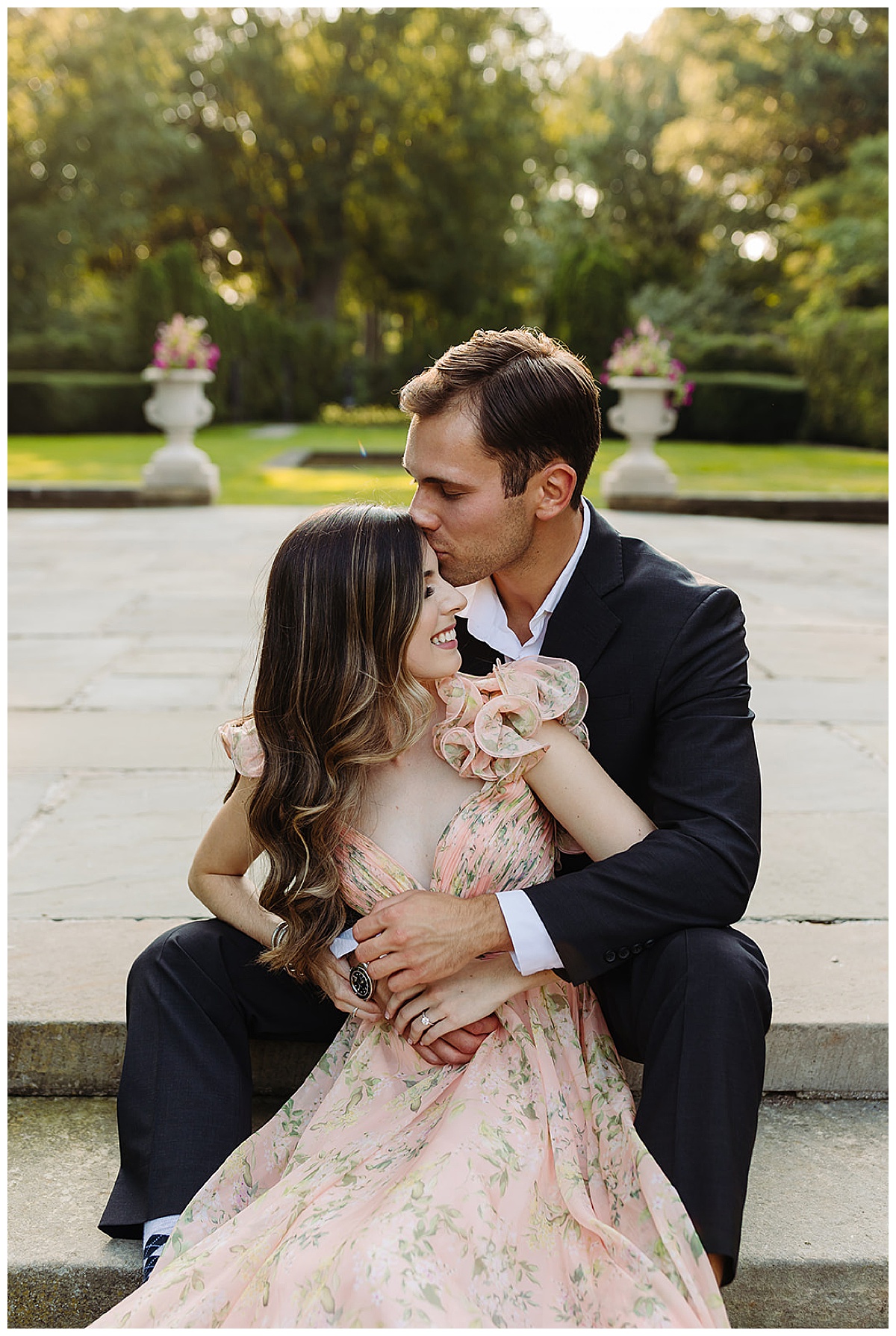 Husband and wife sit on steps together for Kayla Bouren Photography
