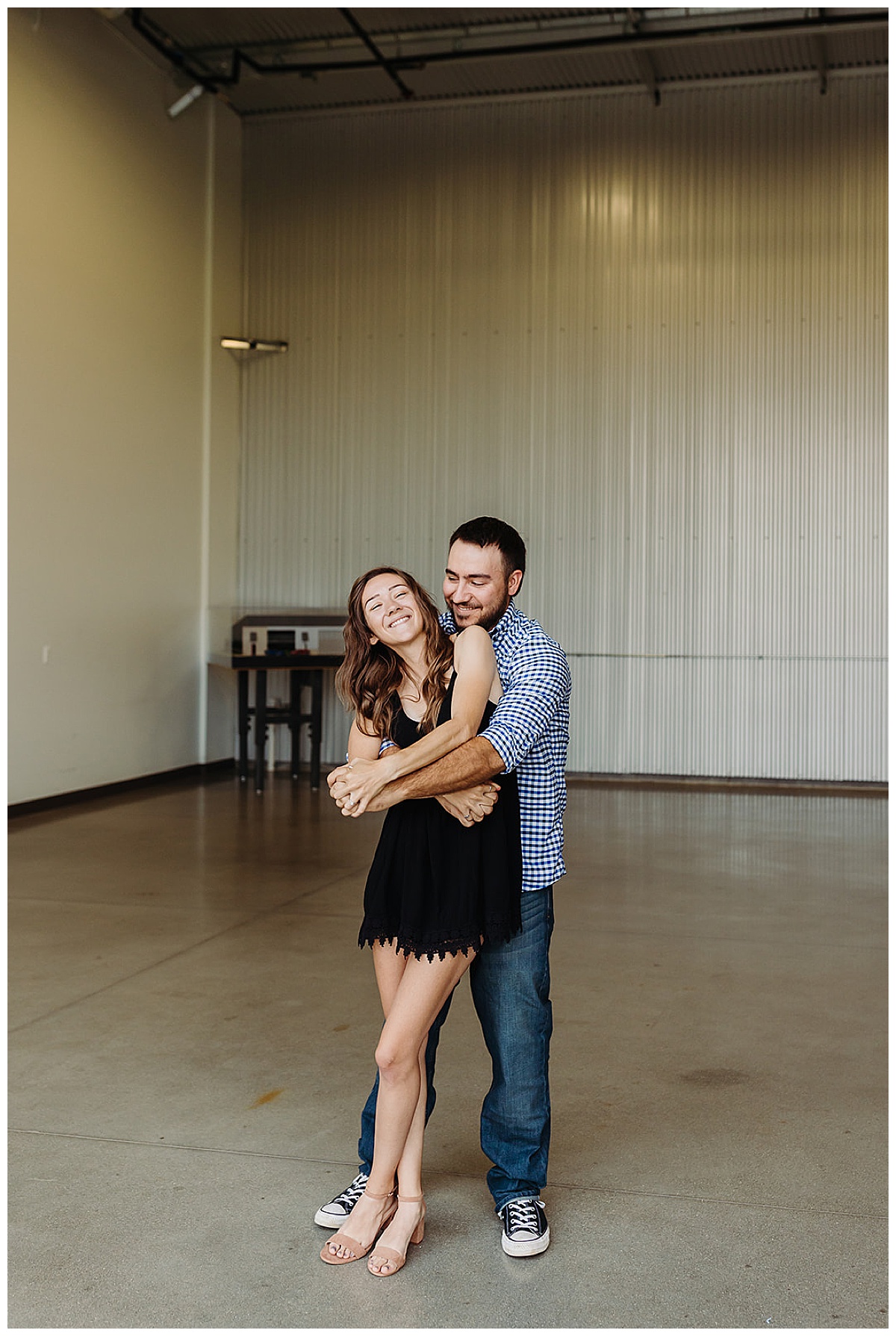 Couple smile and dance together for Kayla Bouren Photography