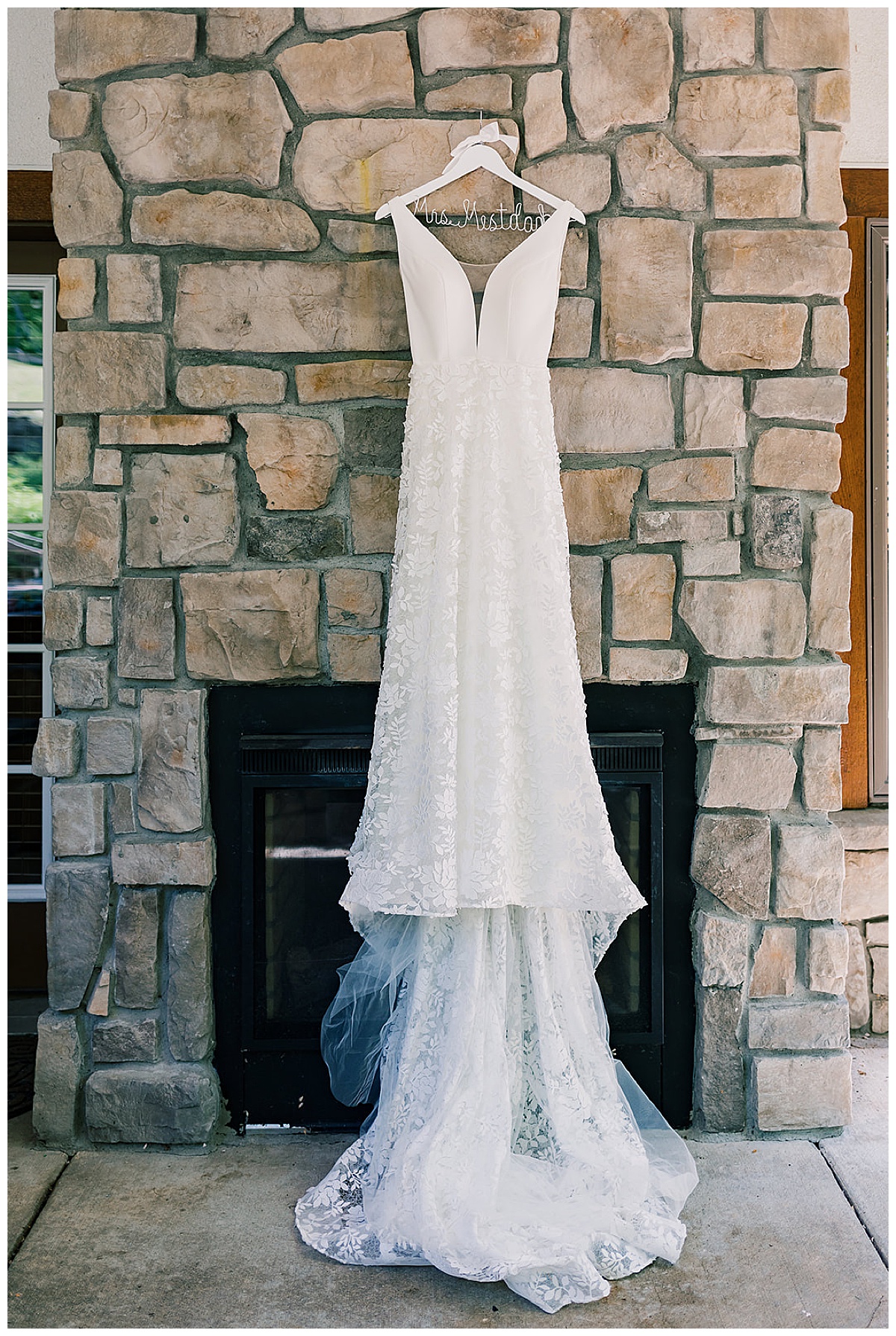 Gorgeous bridal gown hanging on fireplace for Detroit Wedding Photographer