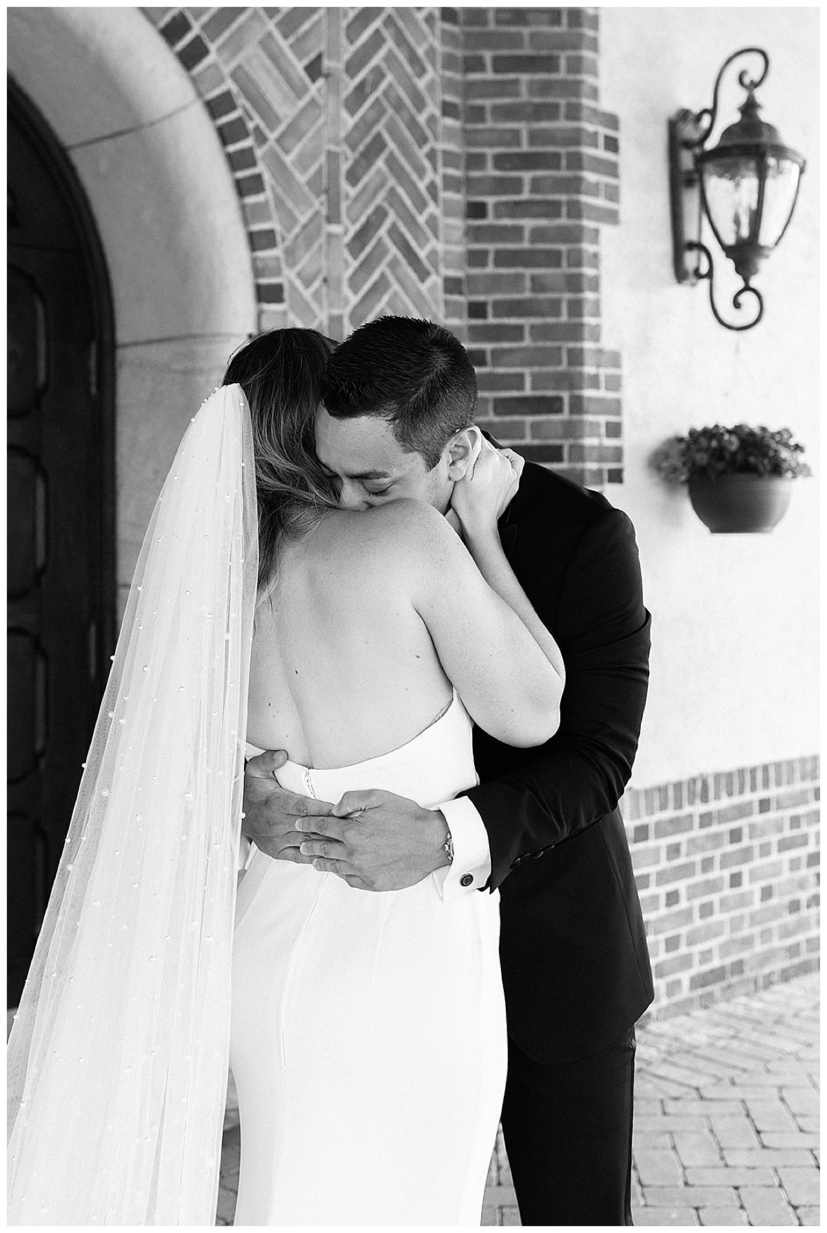 Couple hug one another at Meadowbrook Country Club