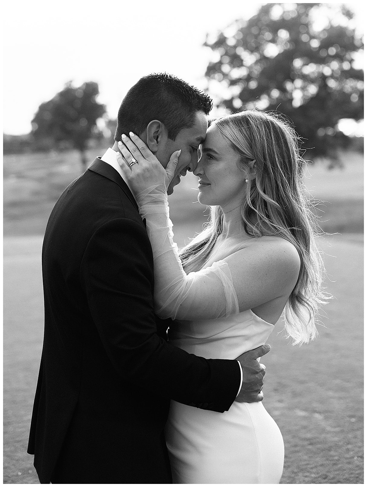 Bride and groom hold one another close for Kayla Bouren Photography