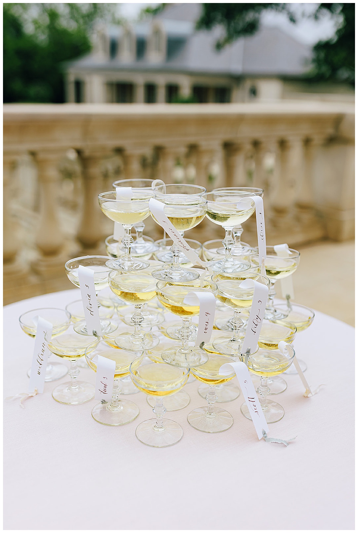 Wedding champagne glasses stacked together for perfectly executed Wedding Photography Timeline