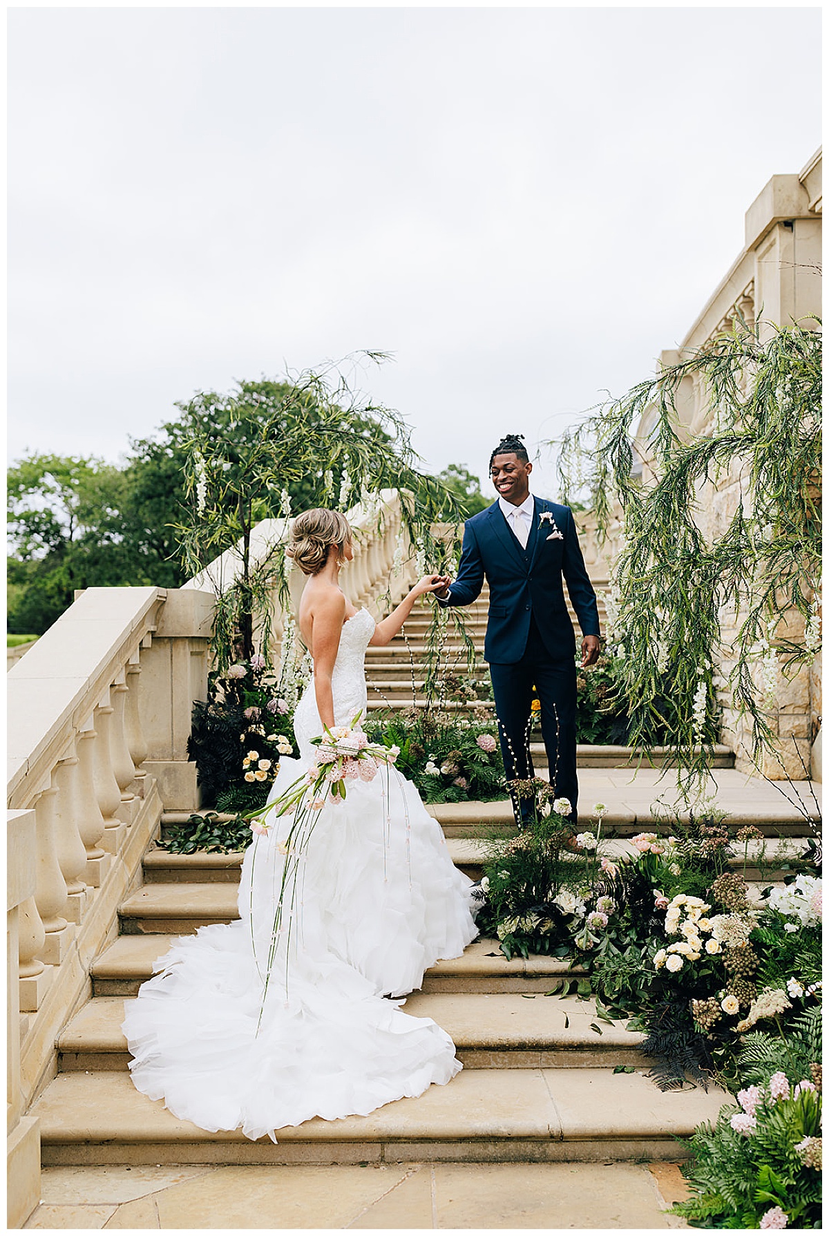 Woman walks up the stairs to her man for Detroit Wedding Photographer 