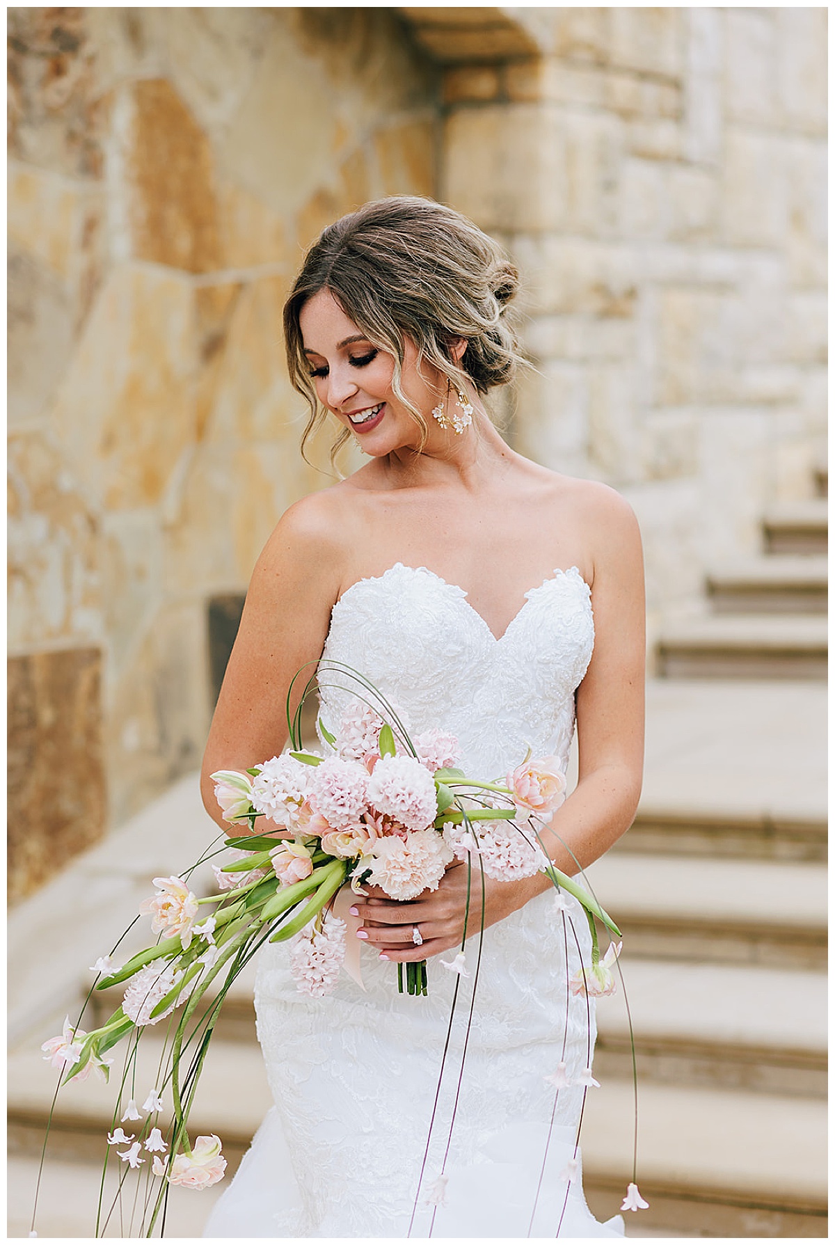 Woman looks down at bouquet for Kayla Bouren Photography