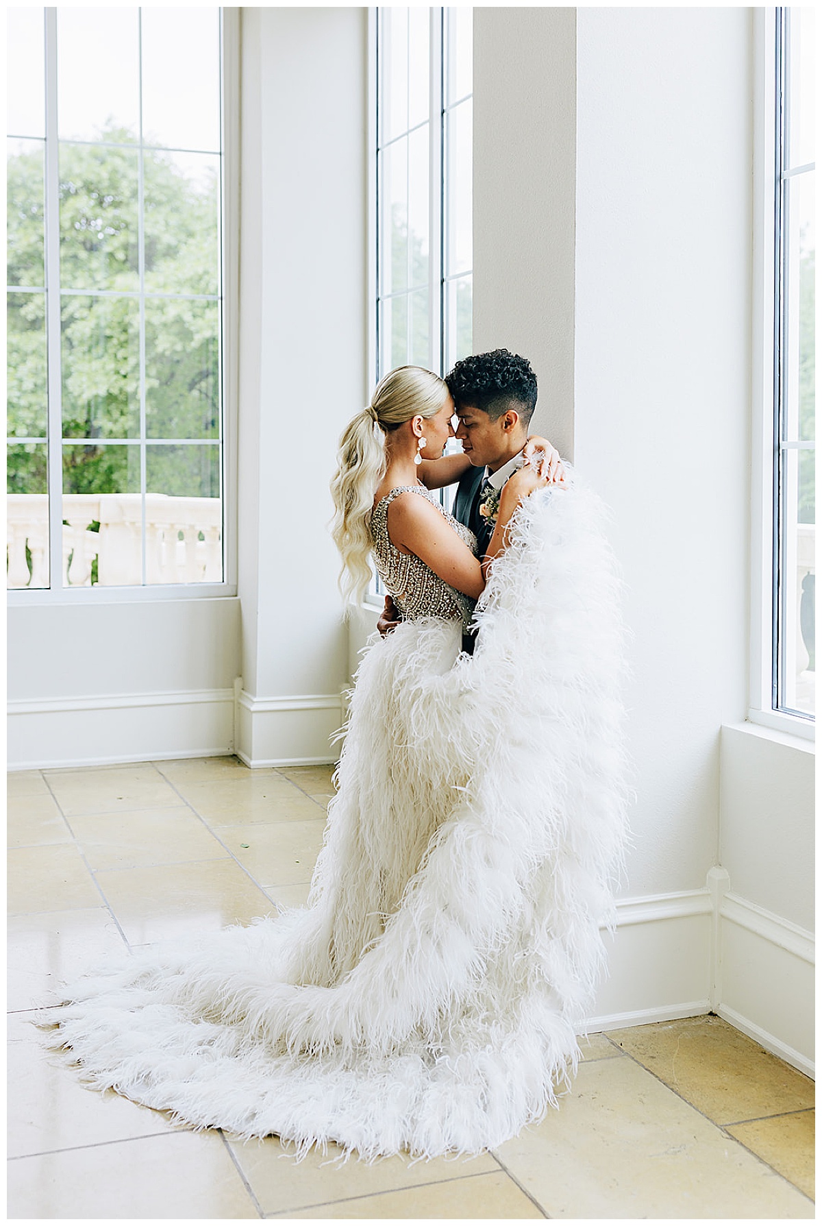 Woman wraps bridal gown around her and her husband for Kayla Bouren Photography