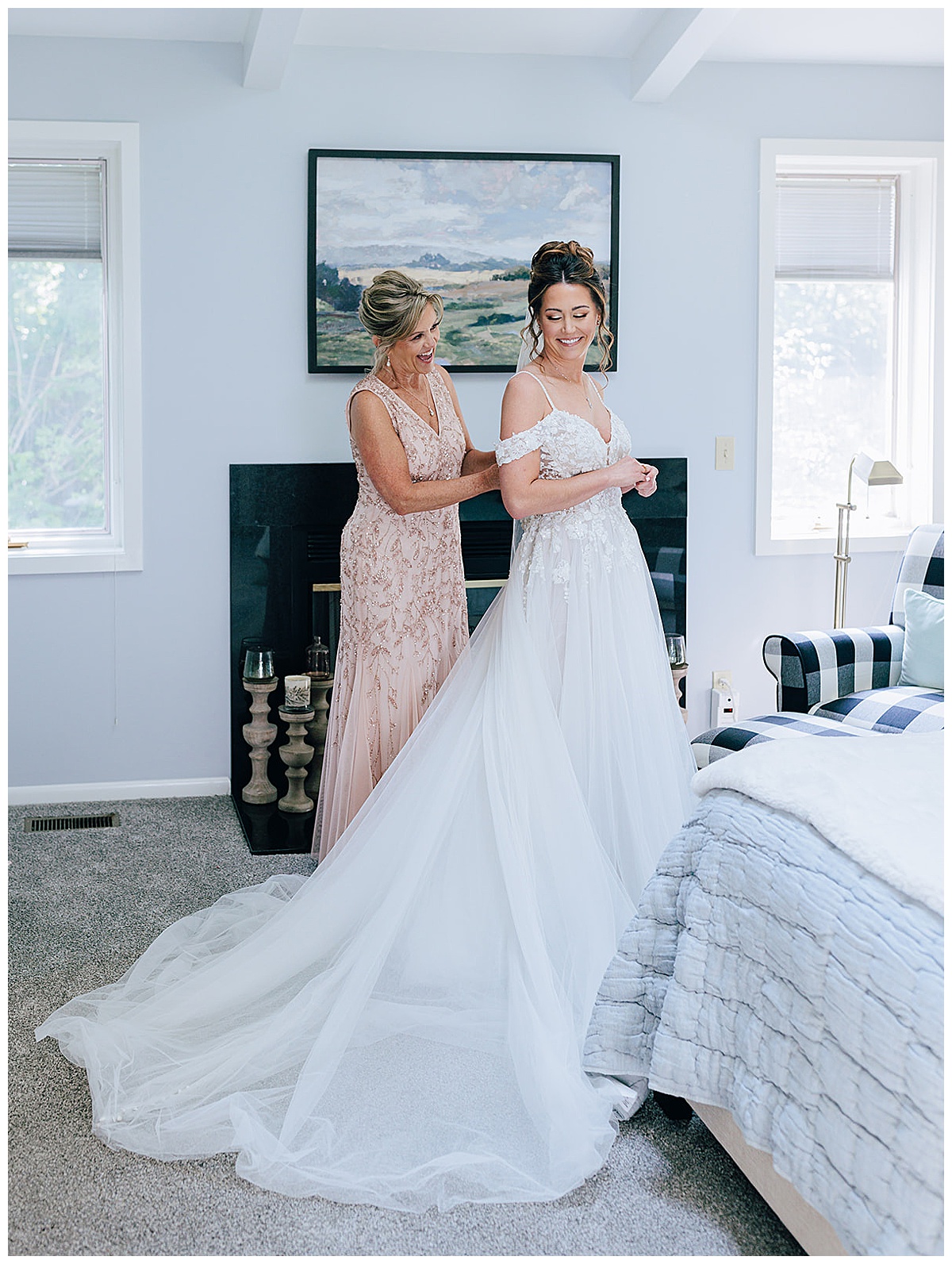 Mother of the bride helps bride in dress for Kayla Bouren Photography