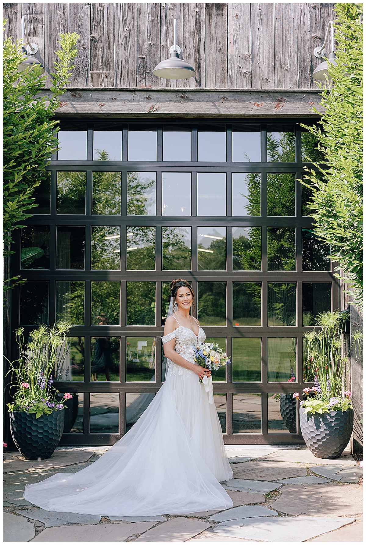 Bride stands in front of their Holly, Michigan Wedding Venue 