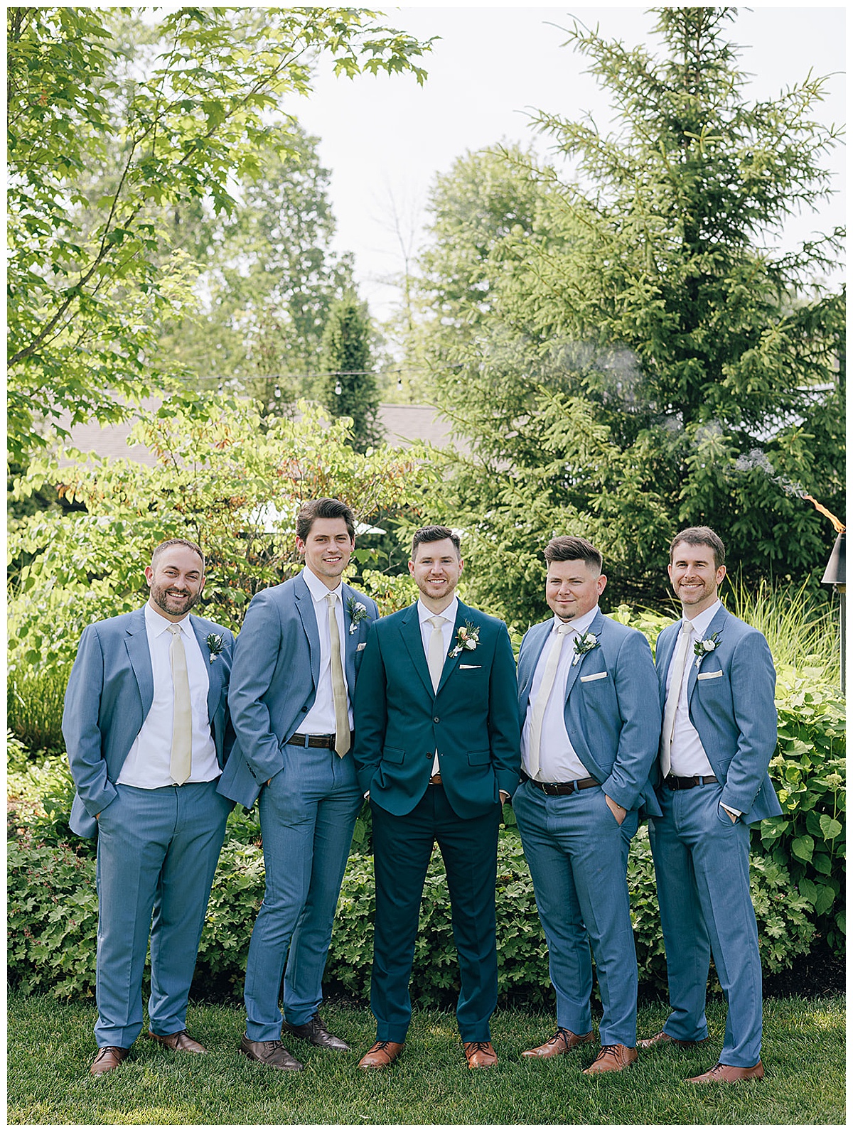Groom stands with friends and family for Detroit Wedding Photographer