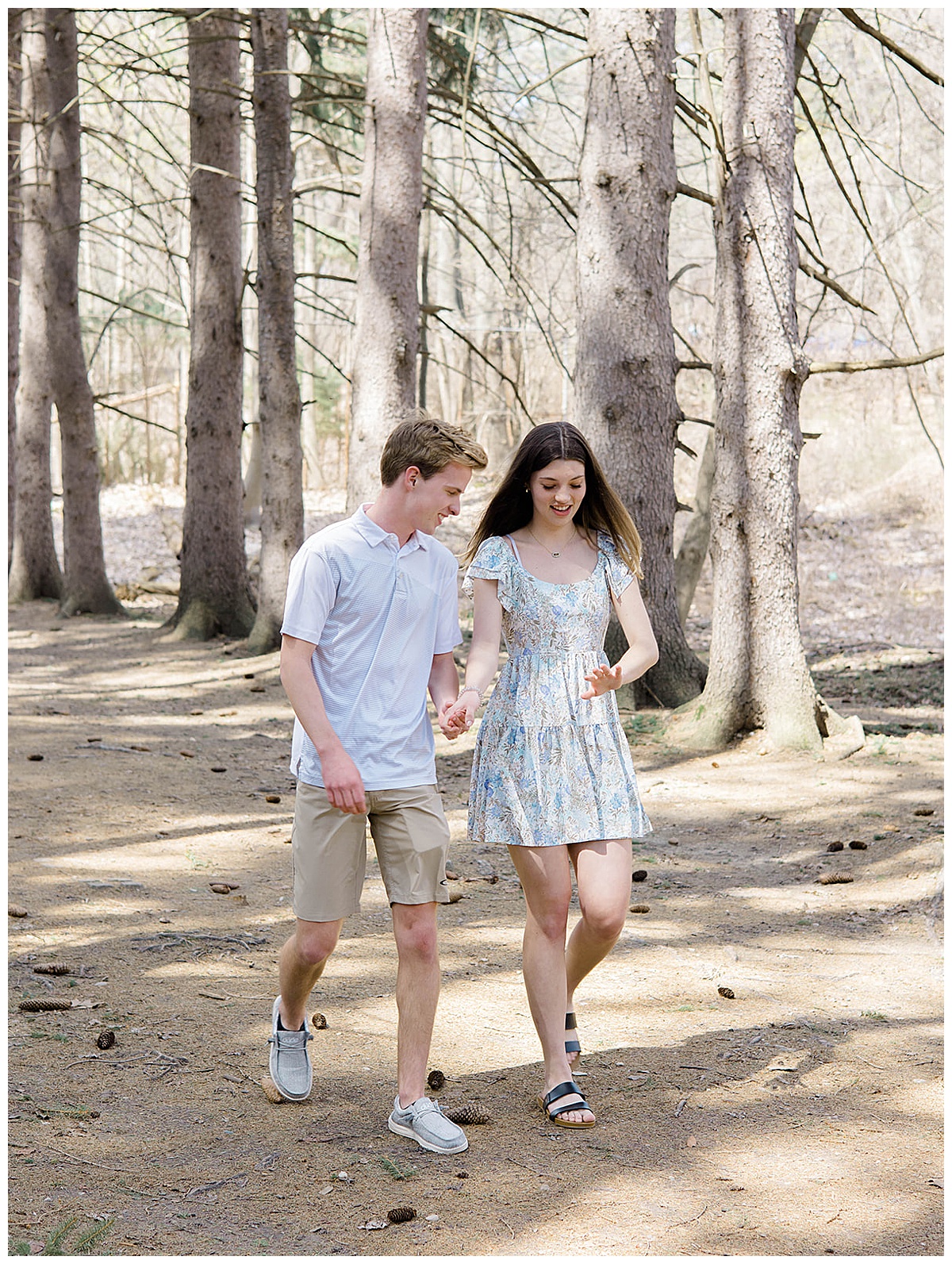 Two people walk hand in hand together for Kayla Bouren Photography
