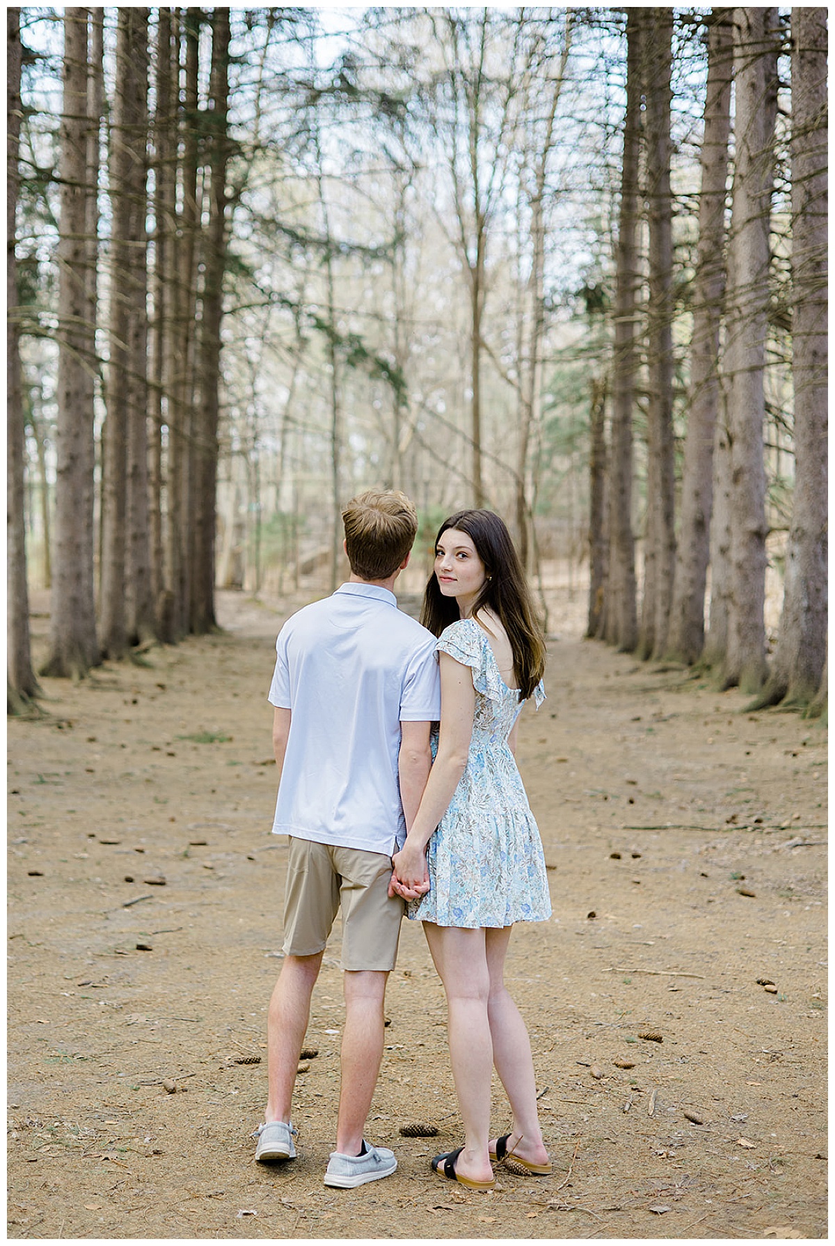 Man and woman hold hands for Kayla Bouren Photography
