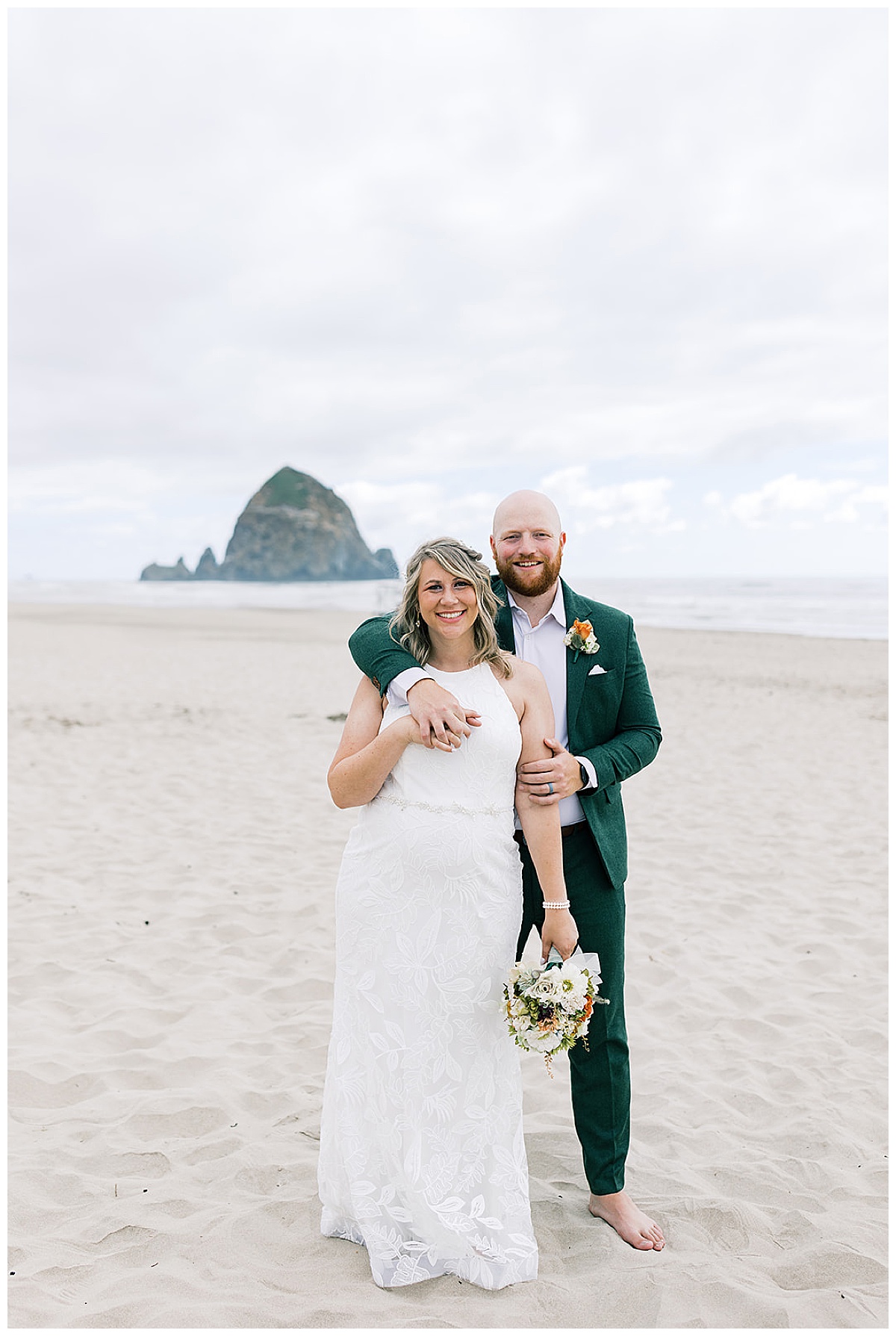 Bride and groom stand together for Cannon Beach, Oregon, wedding