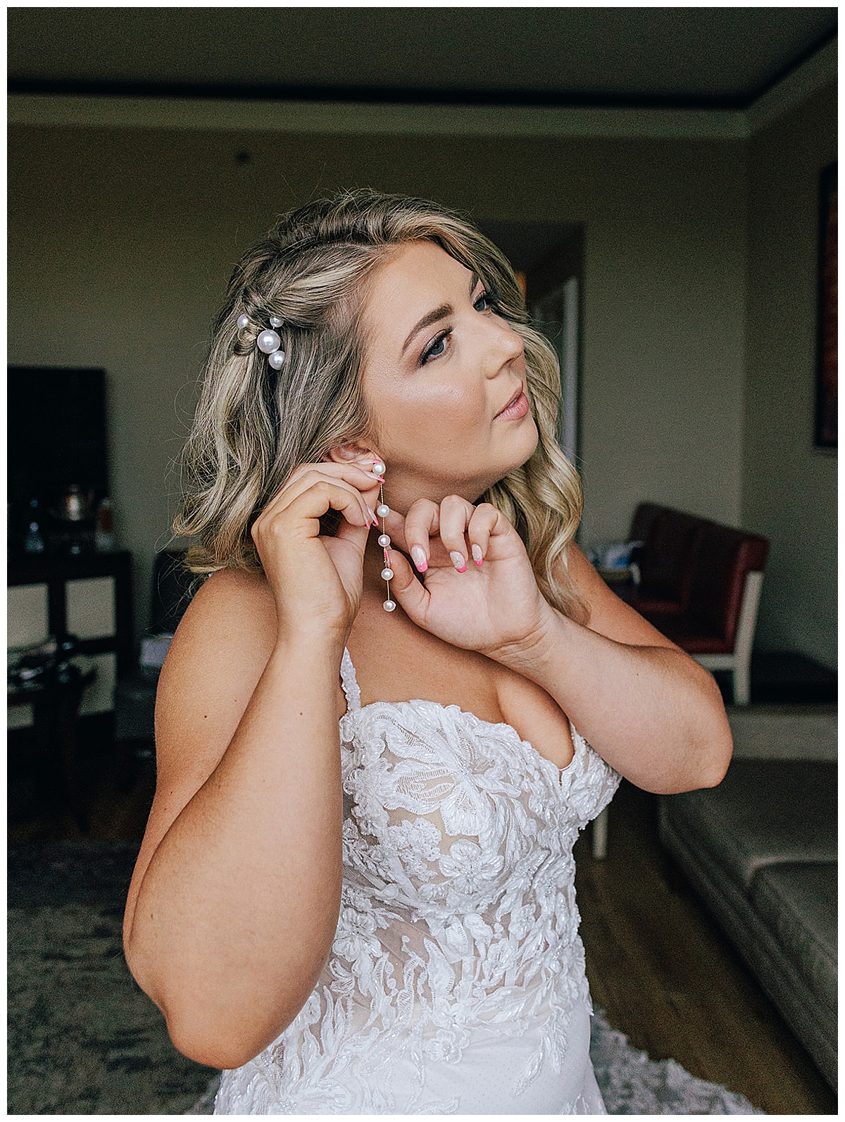 Bride adjusts her wedding jewelry for Detroit Wedding Photographer