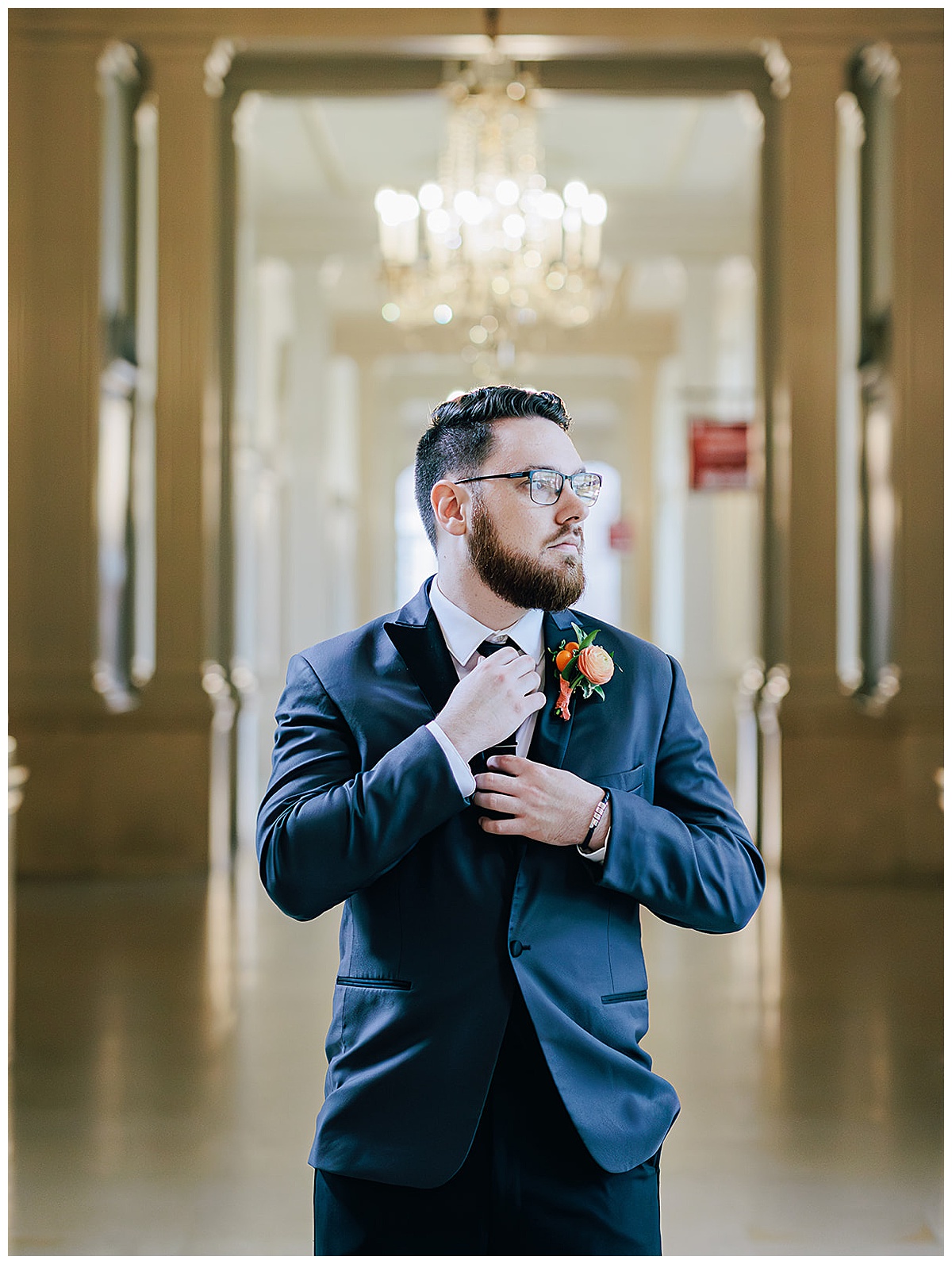 Groom adjusts tie for Detroit Wedding Photographer