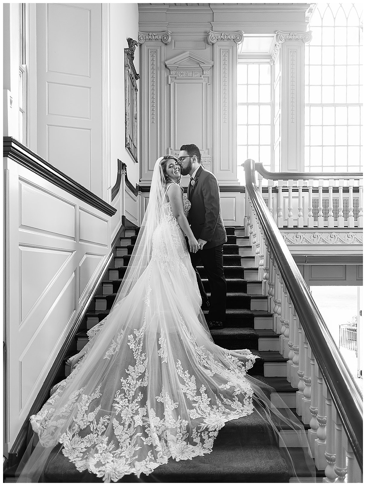 Groom leads bride up the stairs for Kayla Bouren Photography