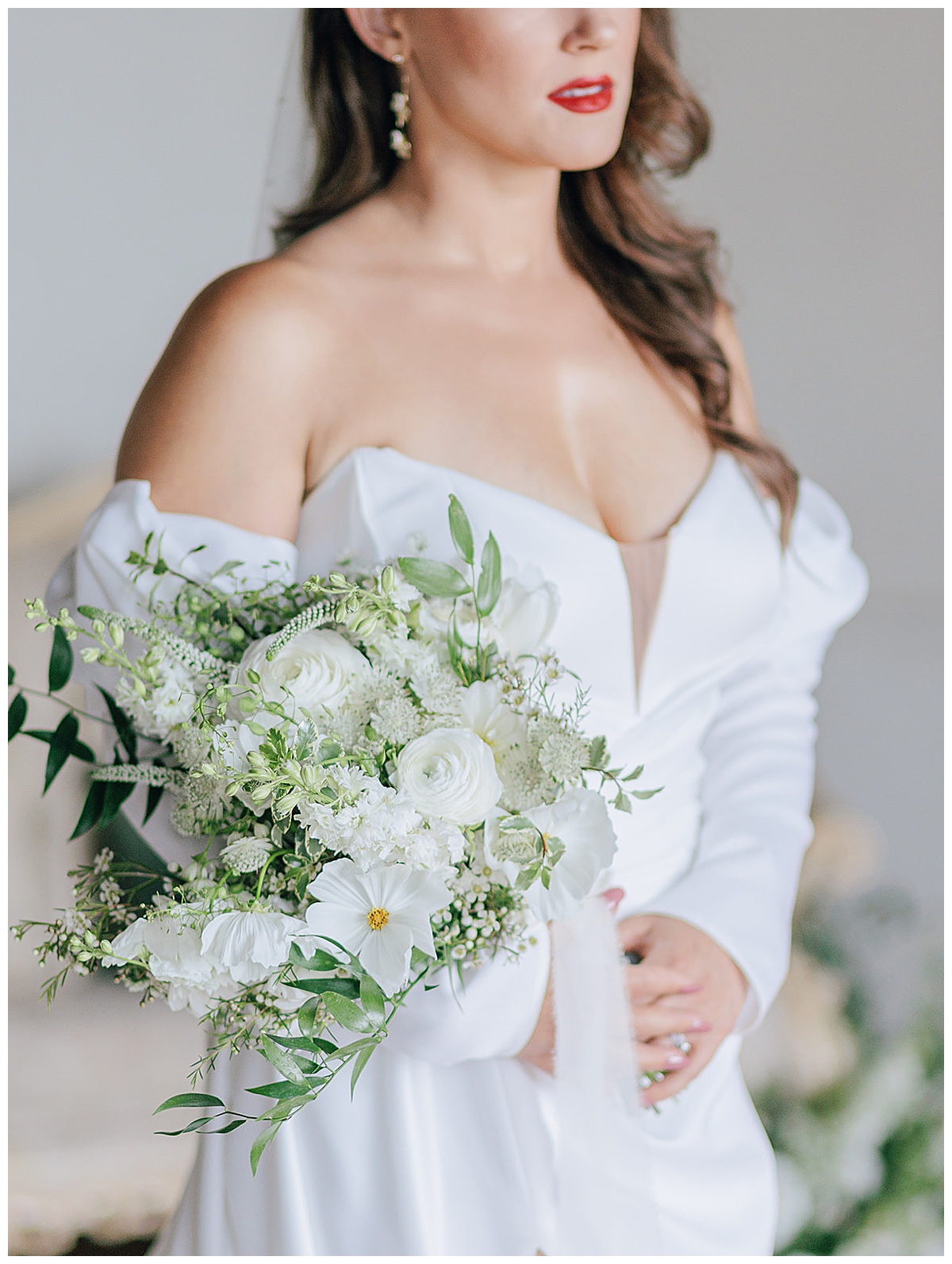 Stunning bride holds a gorgeous white bouquet during this War Memorial Editorial