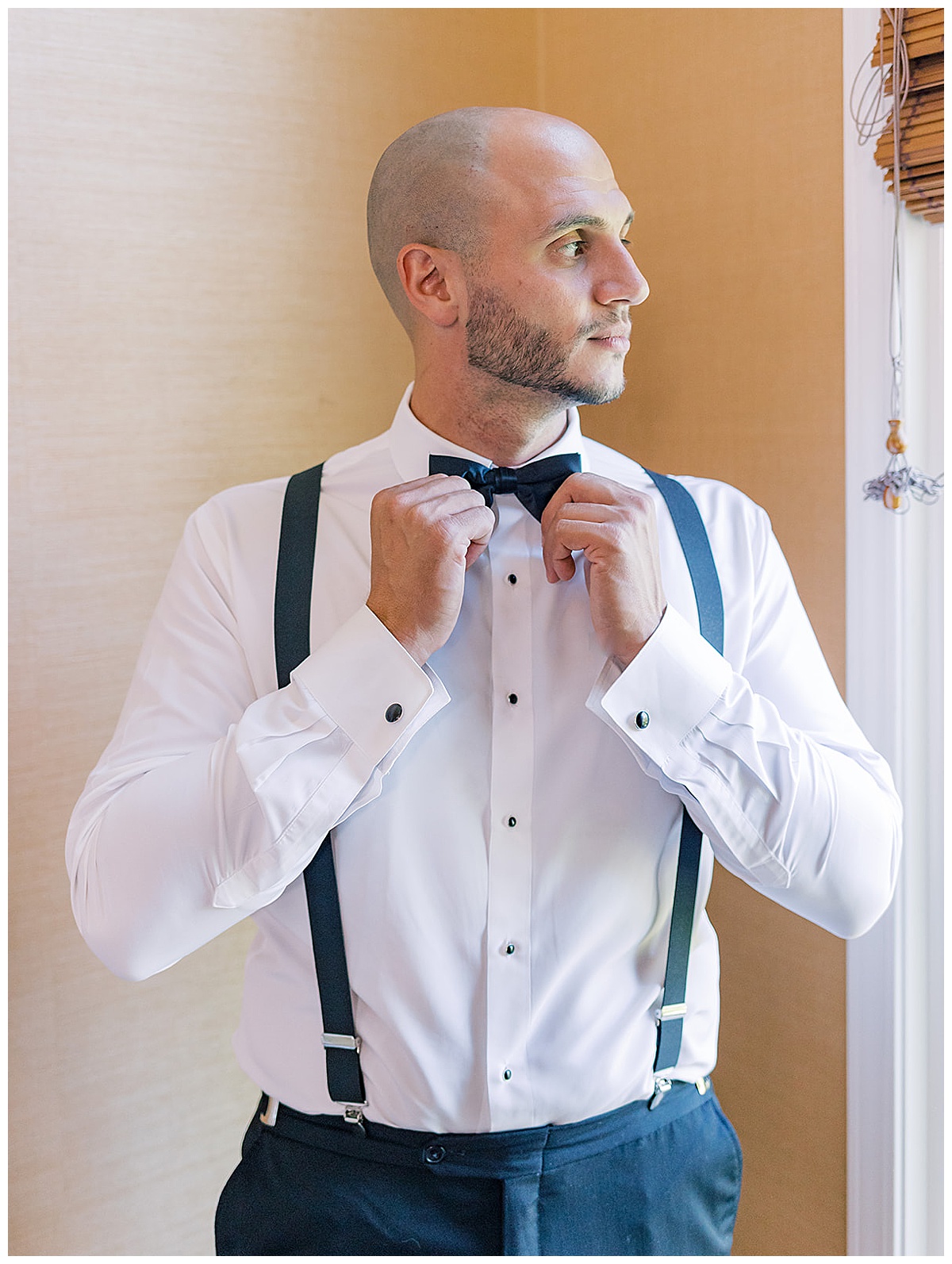 Groom adjust tie for Luxury Wedding at Andiamo Italia