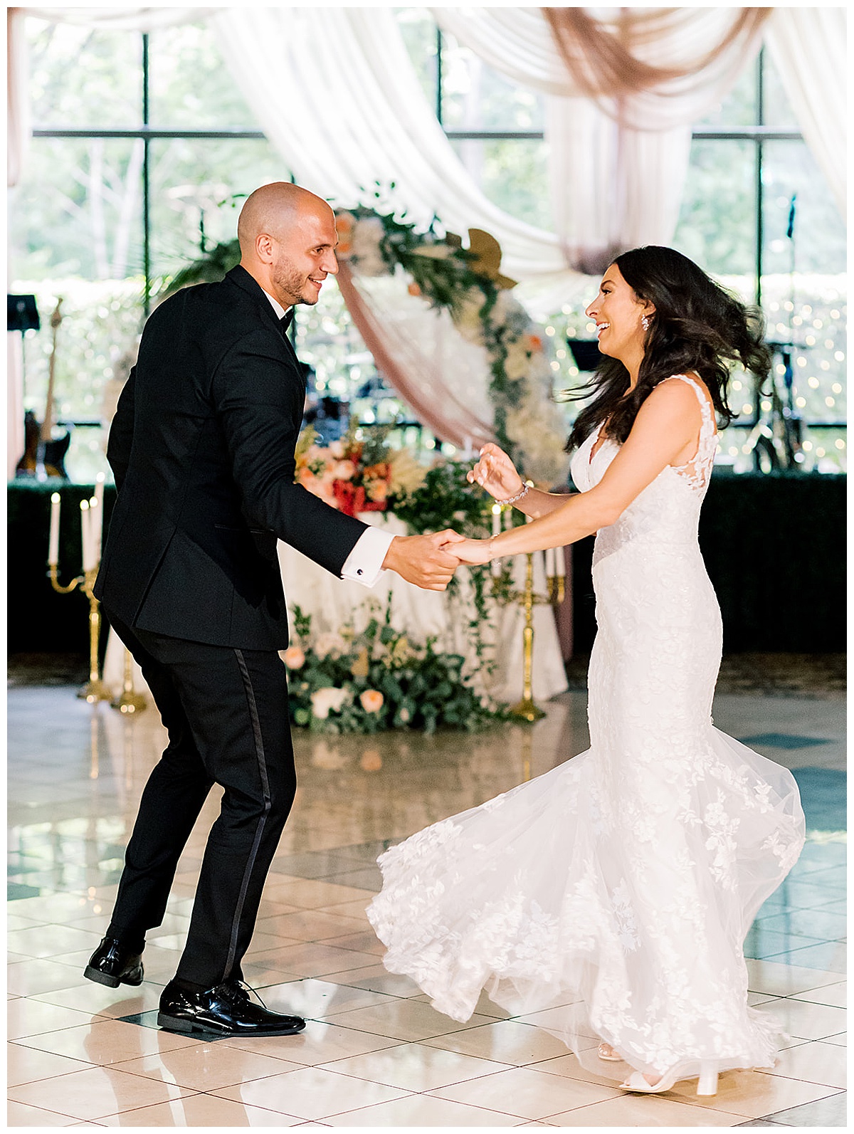 Husband and wife laugh and dance together for Kayla Bouren Photography
