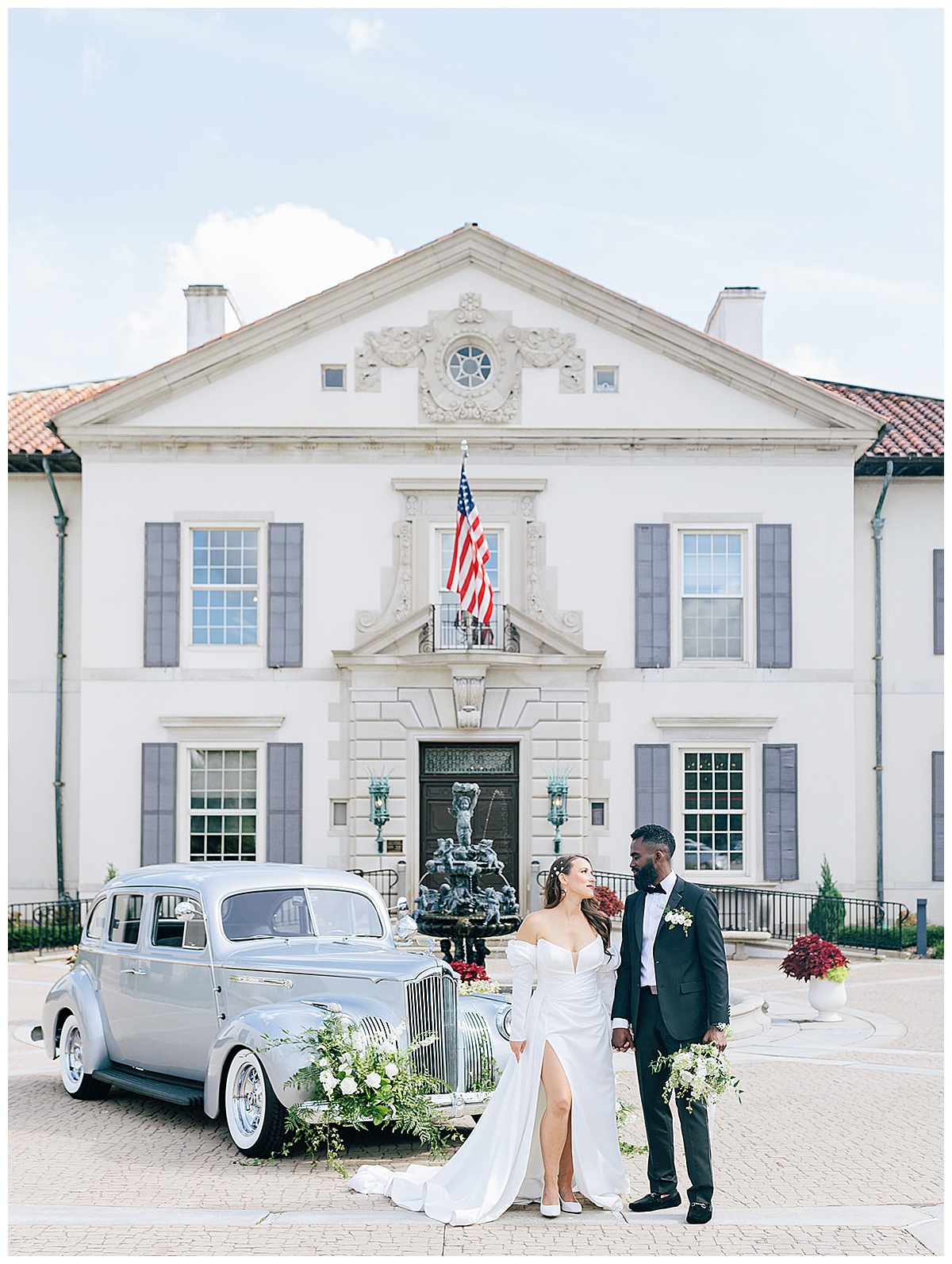 Happy couple stand in front of a luxury wedding car for Kayla Bouren Photography