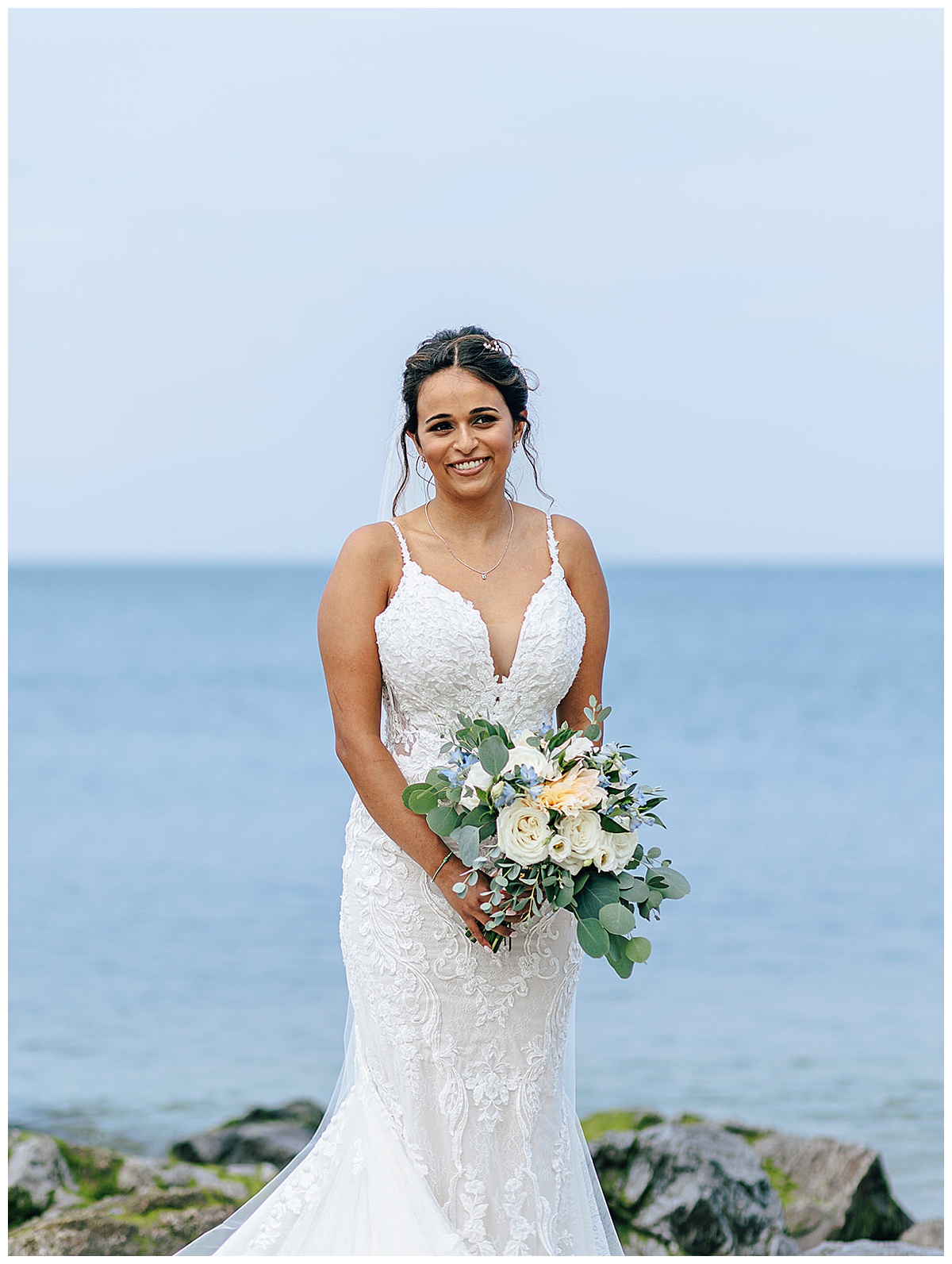 Stunning bride holds bouquet for Detroit Wedding Photographer