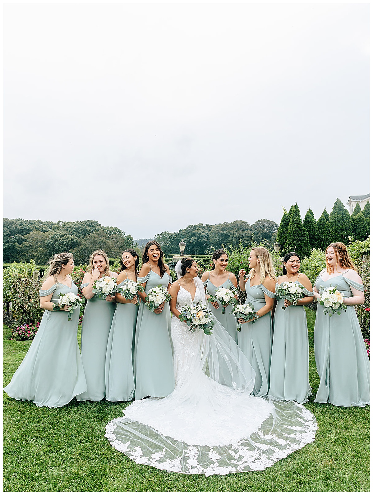Bride stands in front of bridal party at Giorgio's Baiting Hollow