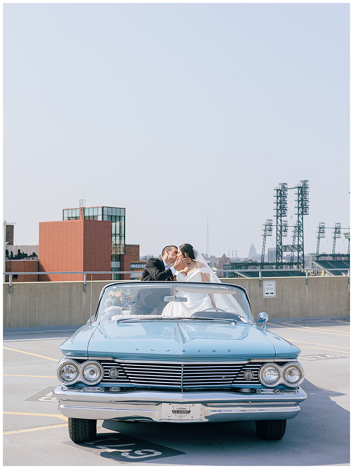 Husband and wife share a kiss for Luxury Wedding at Roostertail