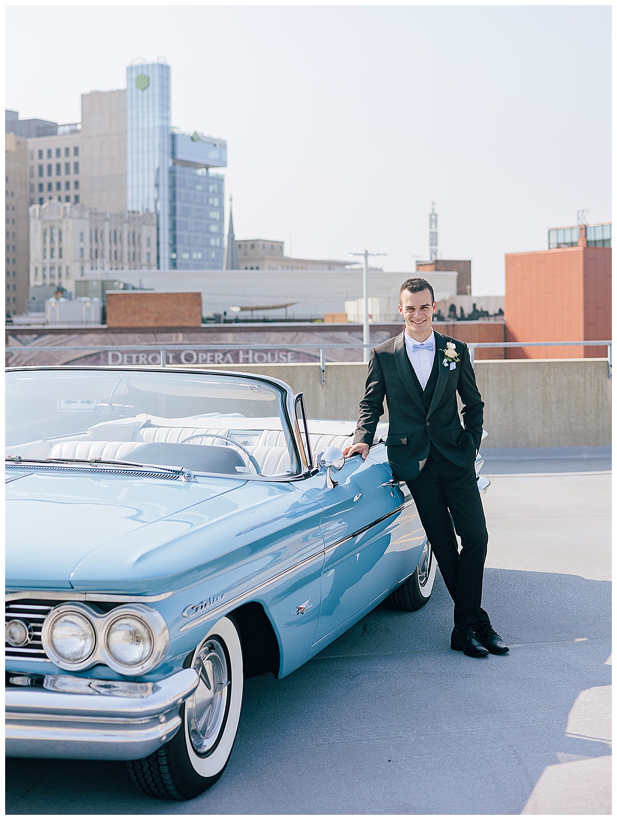 Groom stands near vintage car for Luxury Wedding at Roostertail